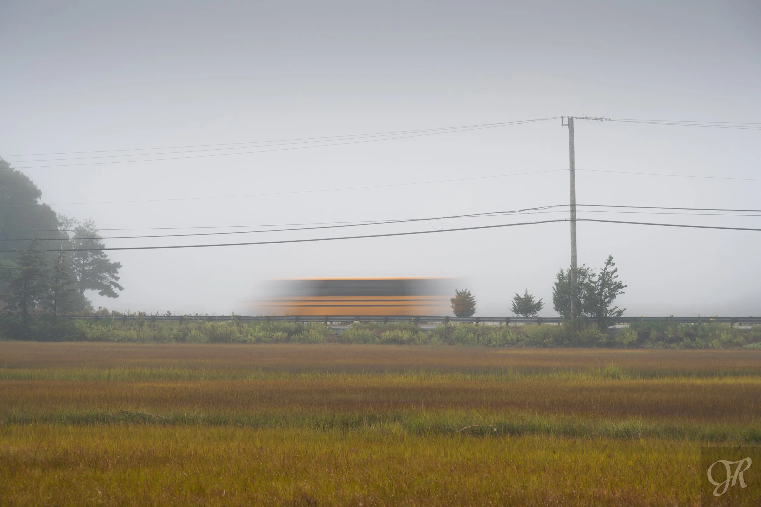  

 
 Early Morning Bus Ride 
 
A school bus ferries students over the marshland of Scorton Creek along the Old King's Highway on a rainy, foggy morning.
 

 
 Purchase Print 
 

 