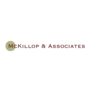 Logo of McKillop & Associates with text and a circular symbol