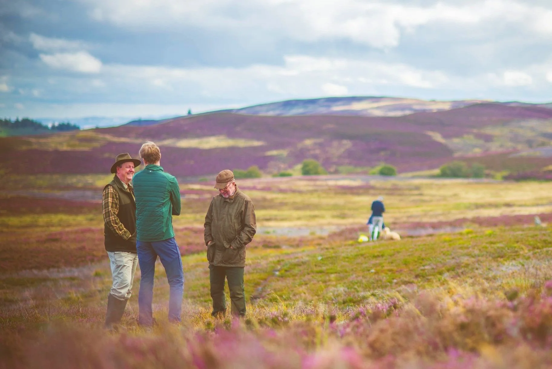 Heather Trust- 3 people conversing at a heather moorland