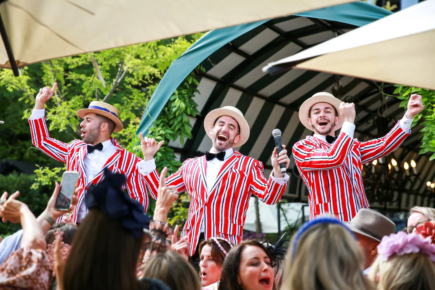 Performers and guests at the race day party