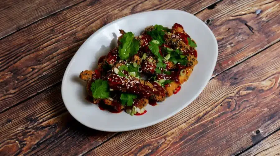 Sesame Crusted Pheasant Goujons With Hot Honey Sauce And Coriander