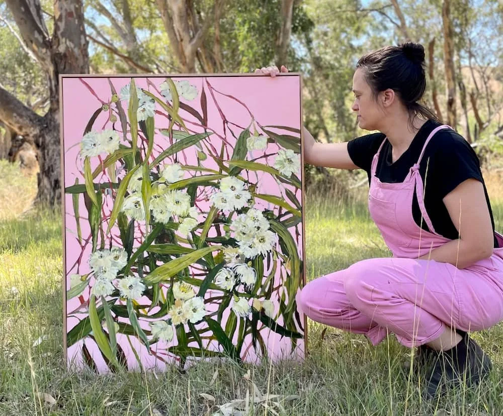 Emily with one of her paintings on her Central Victorian Property
