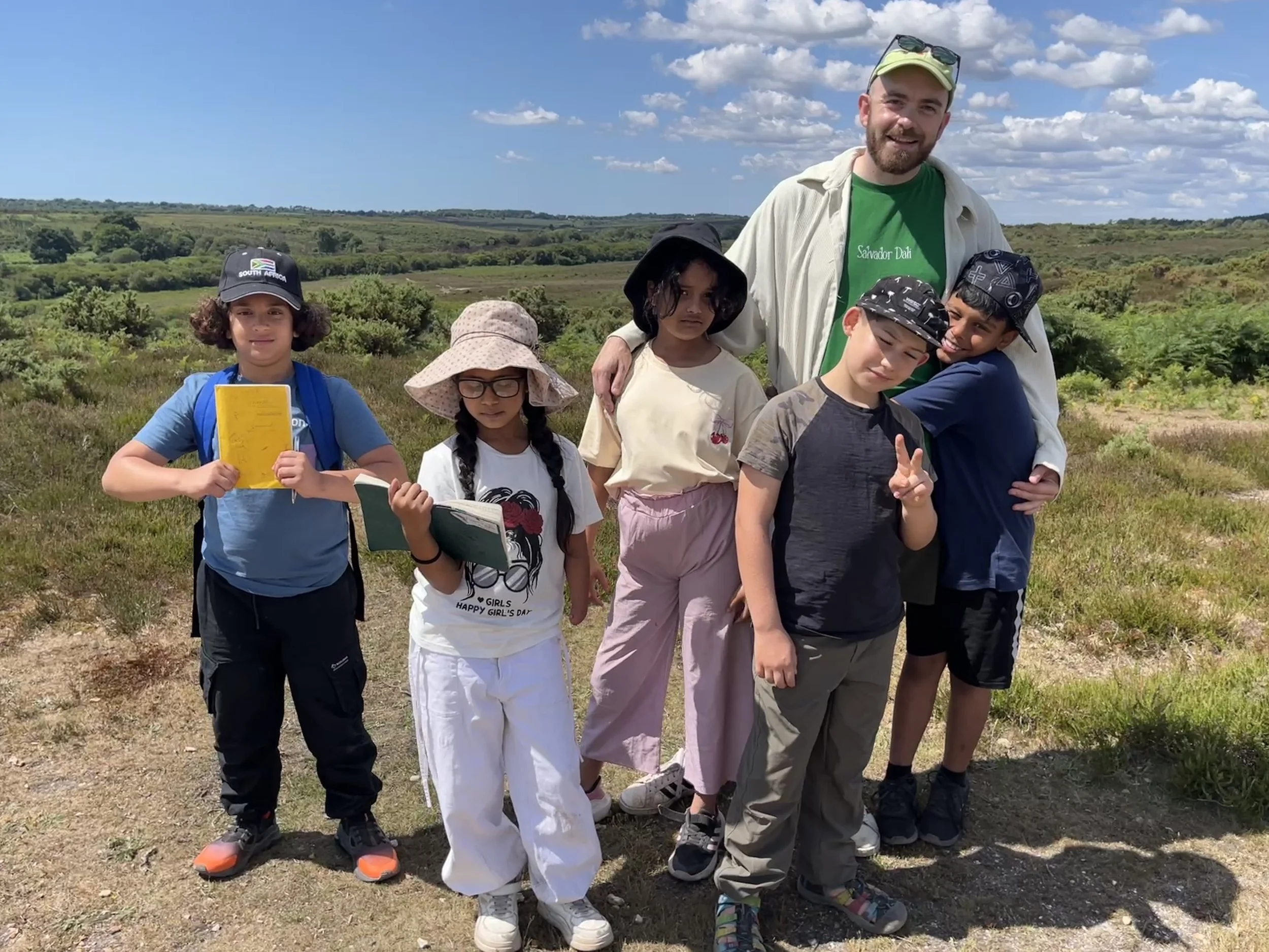 Hill climbing, sketching and poetry-writing with children from the New Vision Trust on a cross-school Poetry Retreat in the New Forest