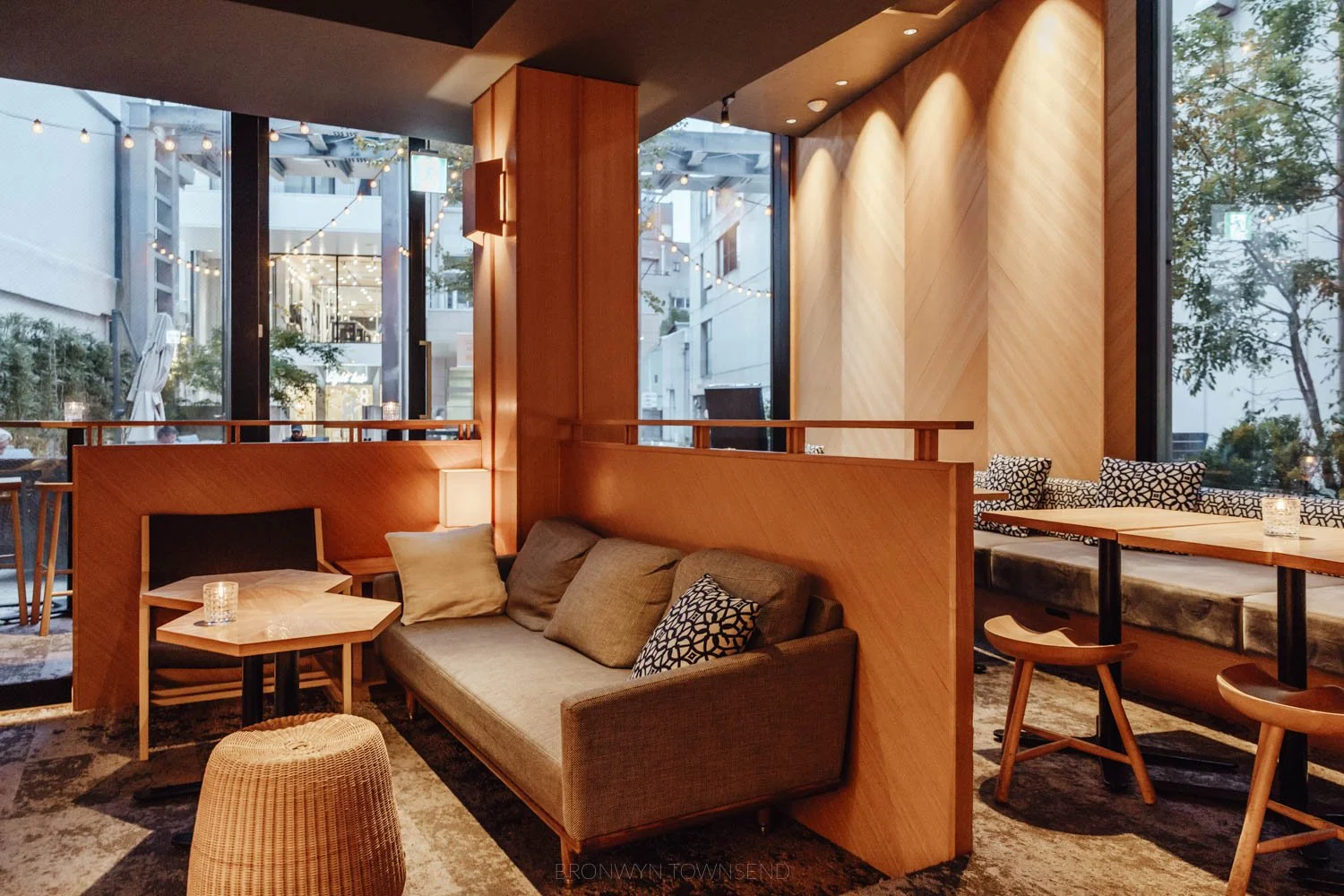 Interior of Kanazawa music bar with low lights, lounges, and light warm wood wall panelling