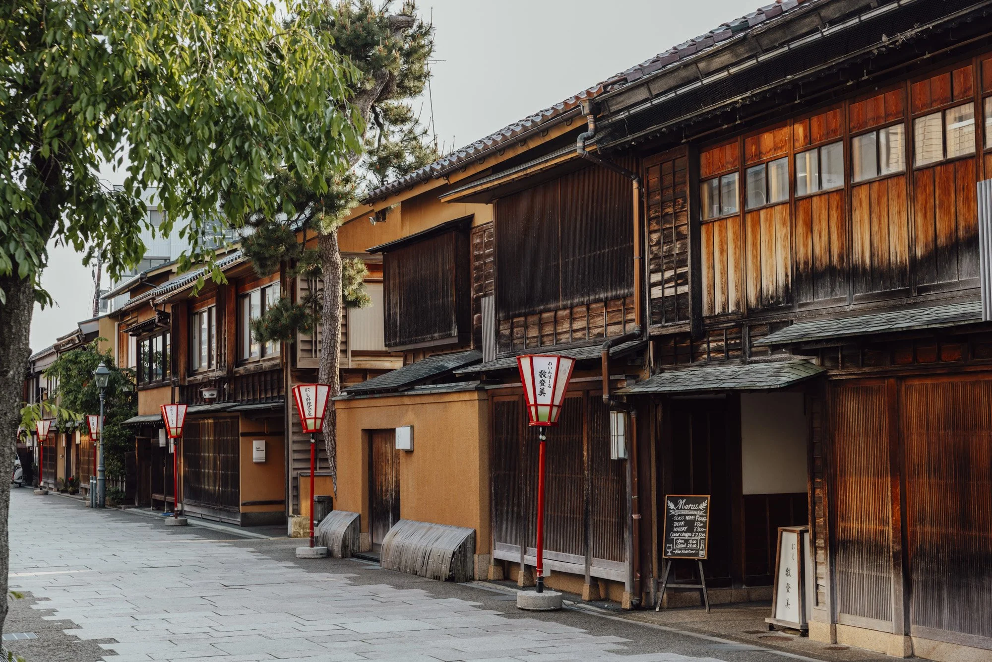 traditional wooden machiya teahouses in Nishi chaya district, Kanazawa on a sunny spring day