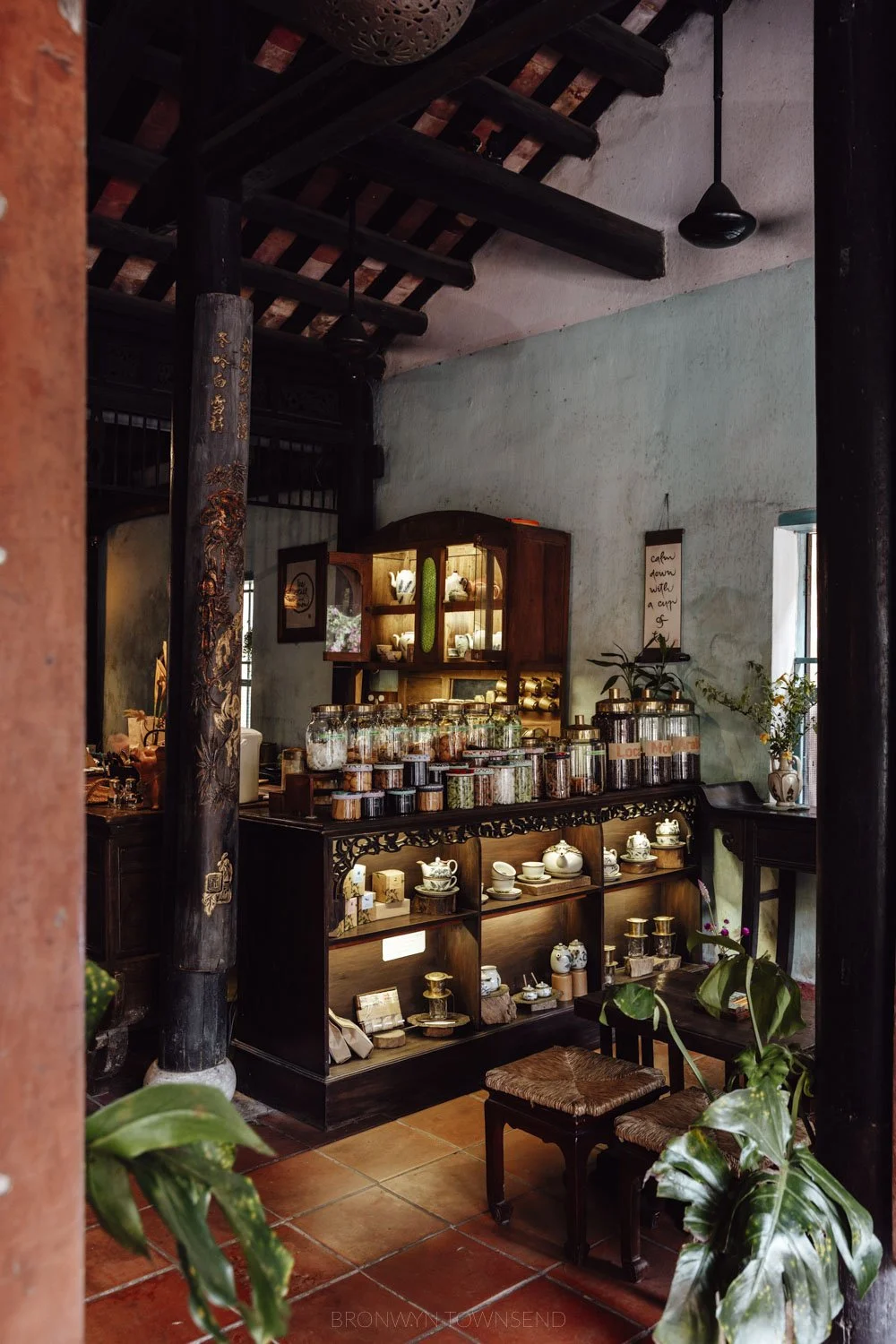 Wooden cabinets in a historic building at reach out teahouse hoi an