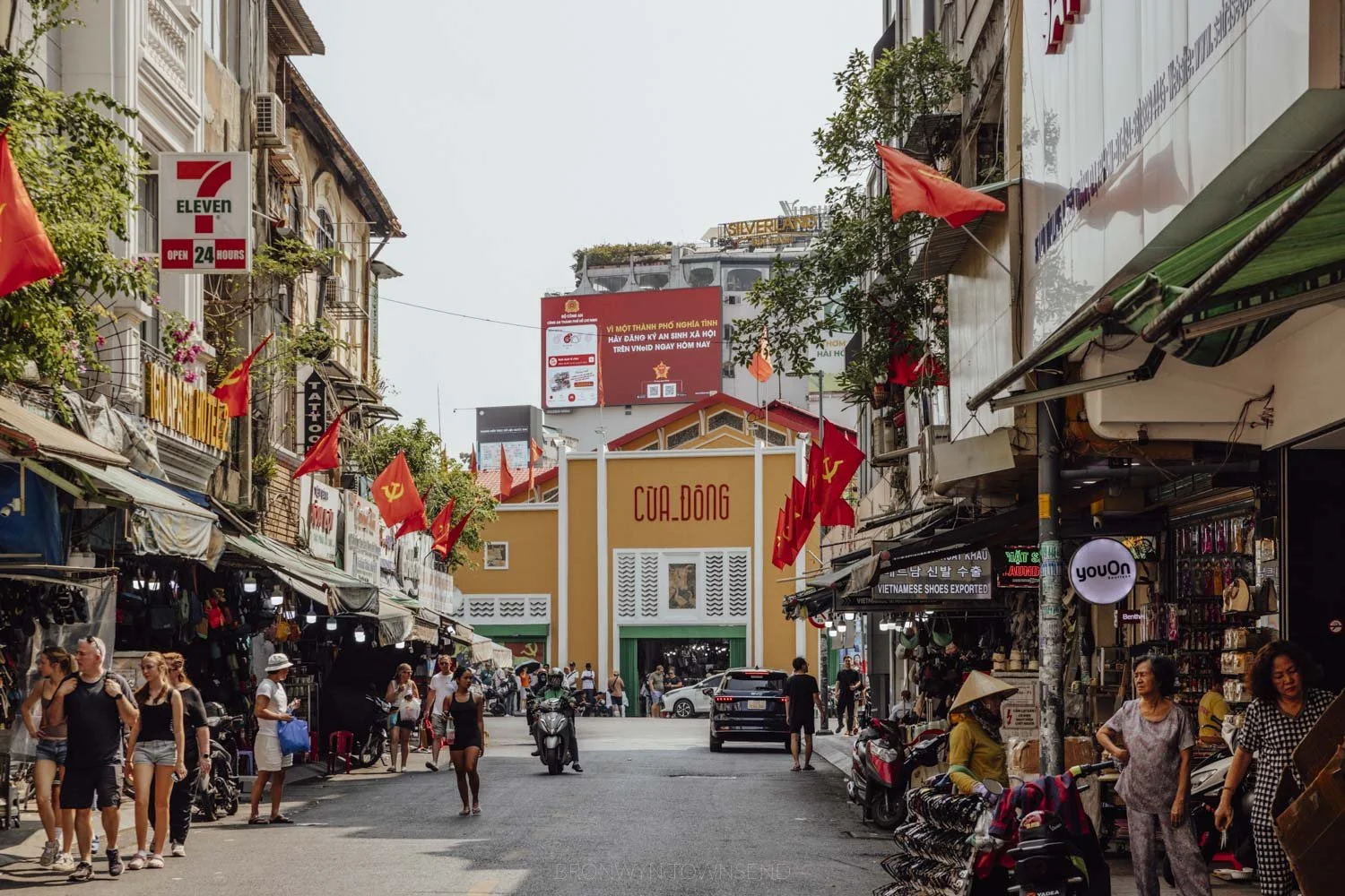 typical street in ho chi minh city leading to market building