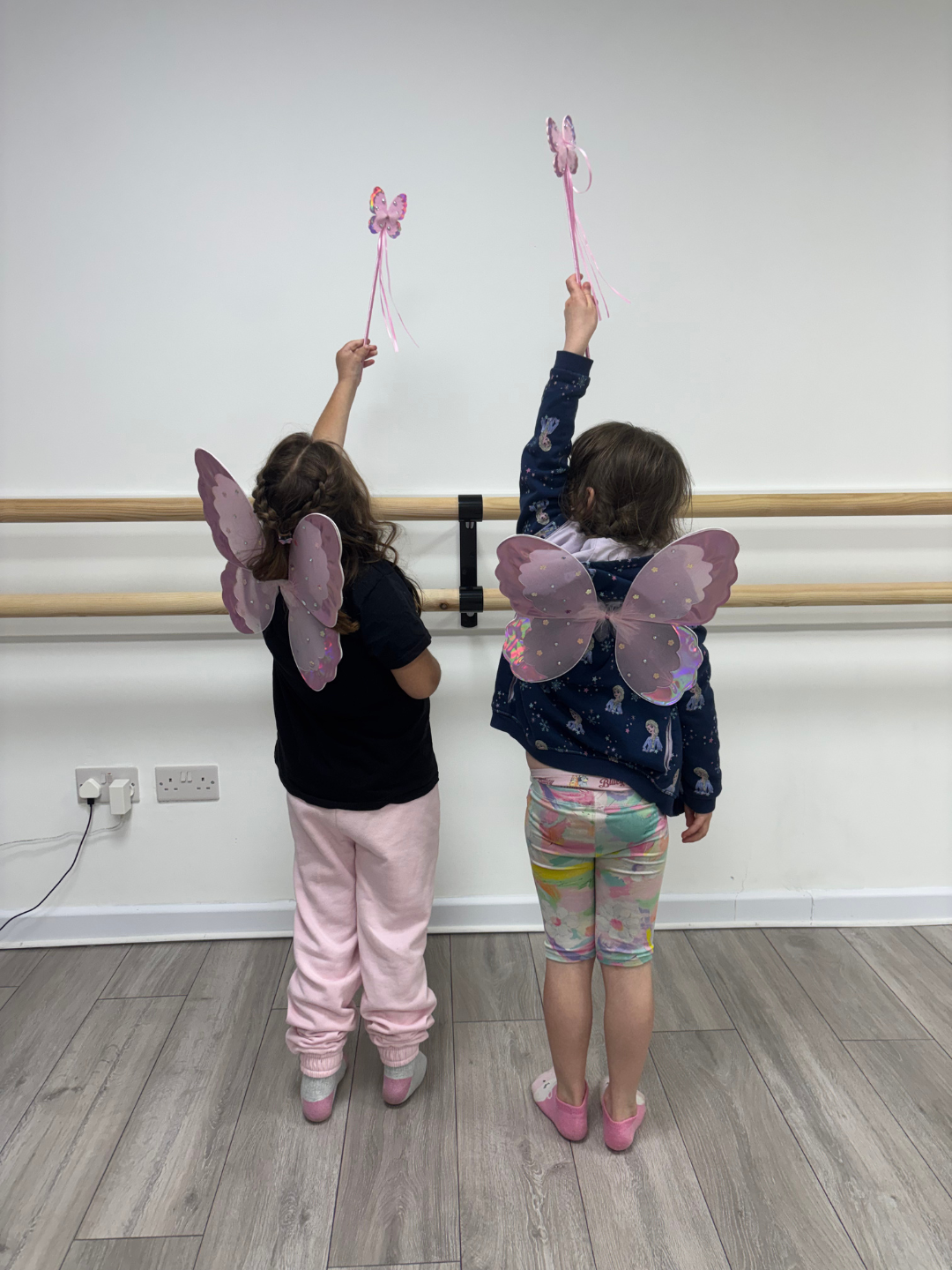 Act One Beginners SEN Drama students in fairy wings and wands arms raised during structured supportive drama session East Grinstead ages 2-18