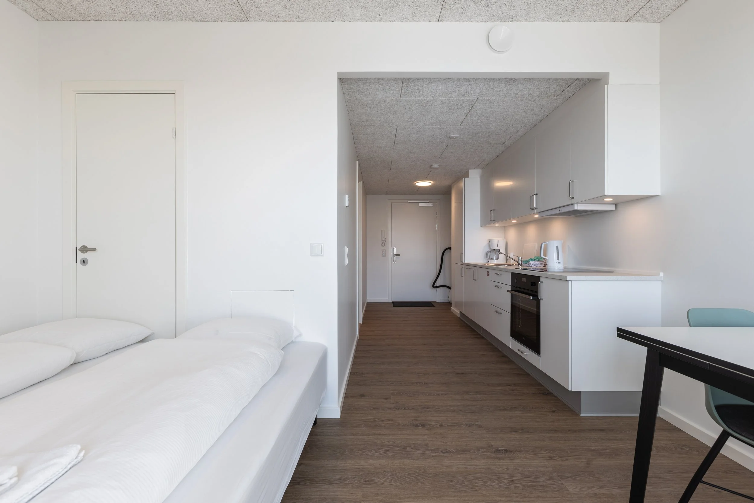 Kitchen equipped with an oven, dishwasher, fridge-freezer and essential kitchenware. A complimentary starter kit is provided upon arrival, including dishwasher detergent and dish towels