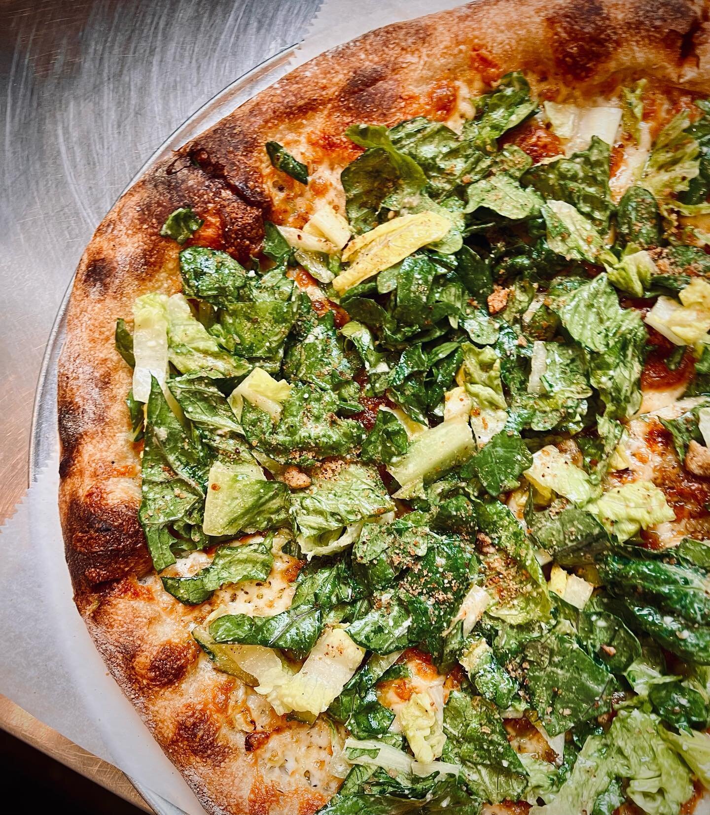 lots of people put salad on pizza

debuting the caesar salad pizza
featuring chef ben&rsquo;s famous dressing, tomten&rsquo;s kale, &amp; homemade breadcrumbs

🤌