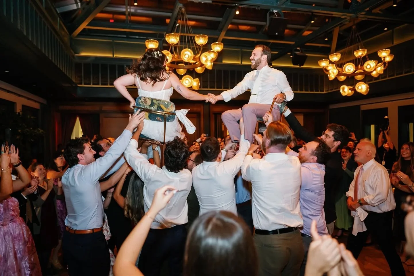 Stephanie and Charlie&rsquo;s hora was a moment of pure celebration. Family and friends surrounded them as they were lifted up above the crowd. The tradition of raising the couple symbolizes unity and the start of their marriage.

Planner:&nbsp;@beau