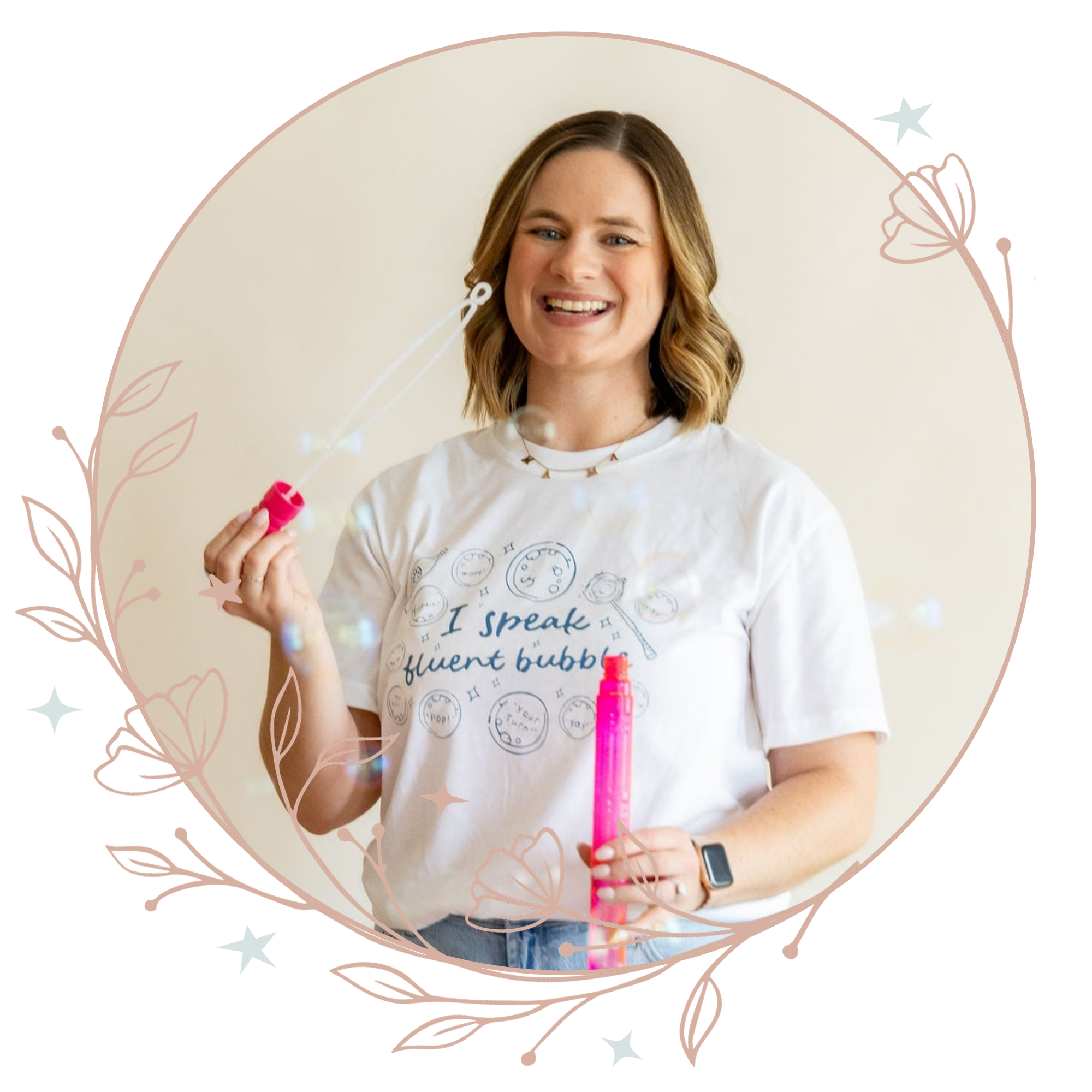 A pediatric speech therapist with shoulder-length wavy hair, smiling while holding a bubble wand and a pink bottle of bubble solution during speech therapy for kids in St. Charles, MO