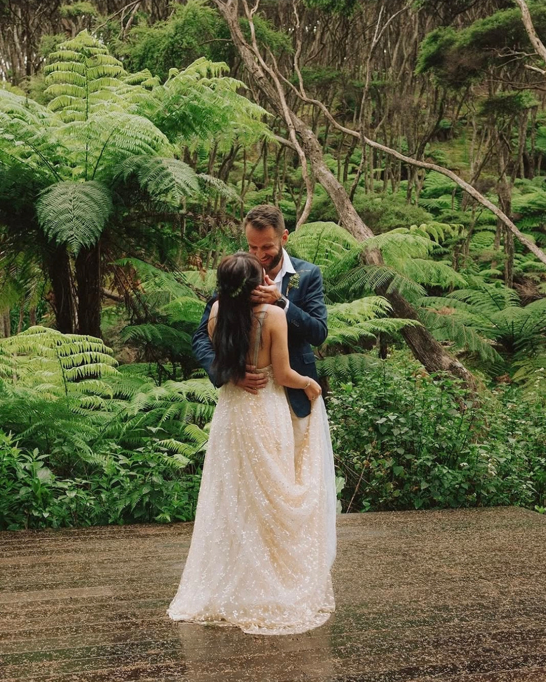 Wedding couple surrounded by native new zealand forest