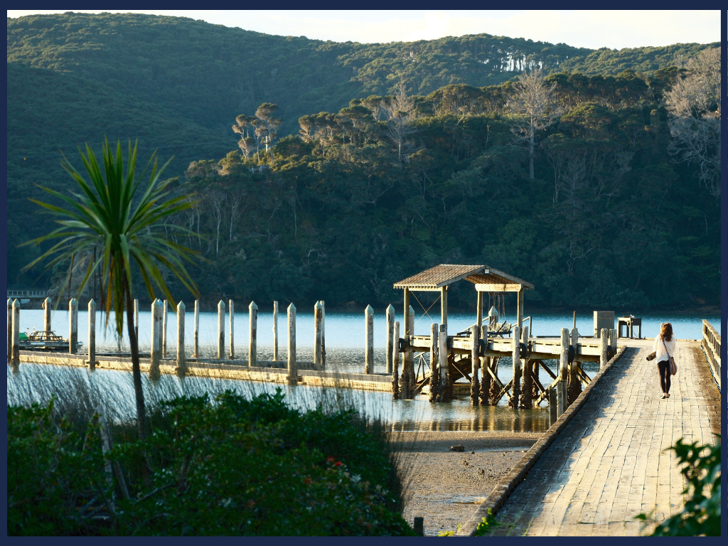 Kawau Island Wharf with a woman walking
