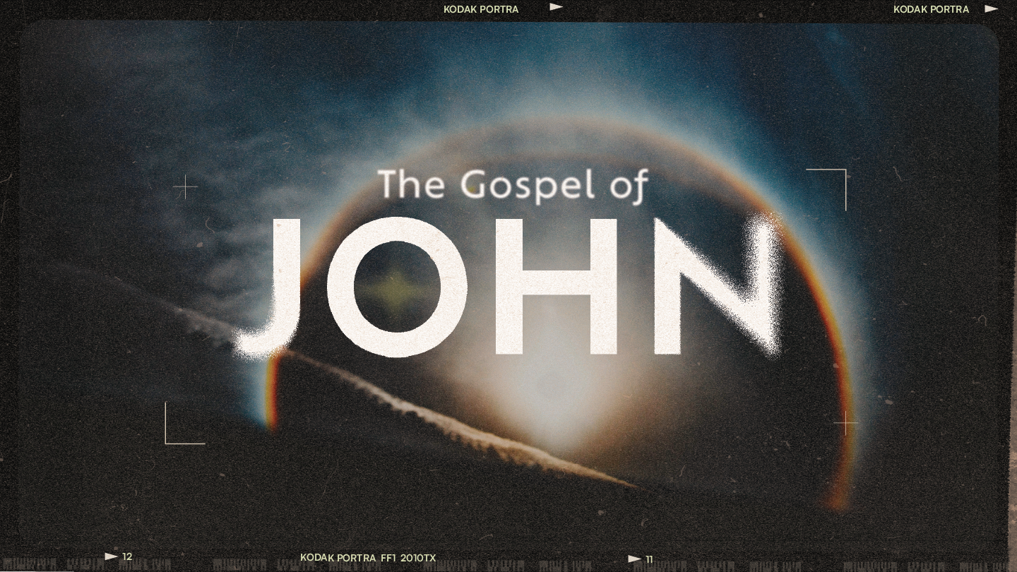 The image features a dark sky with a large, glowing circular phenomenon, possibly an eclipse or planet, with a rainbow-colored edge. Overlaid text reads "The Gospel of JOHN."