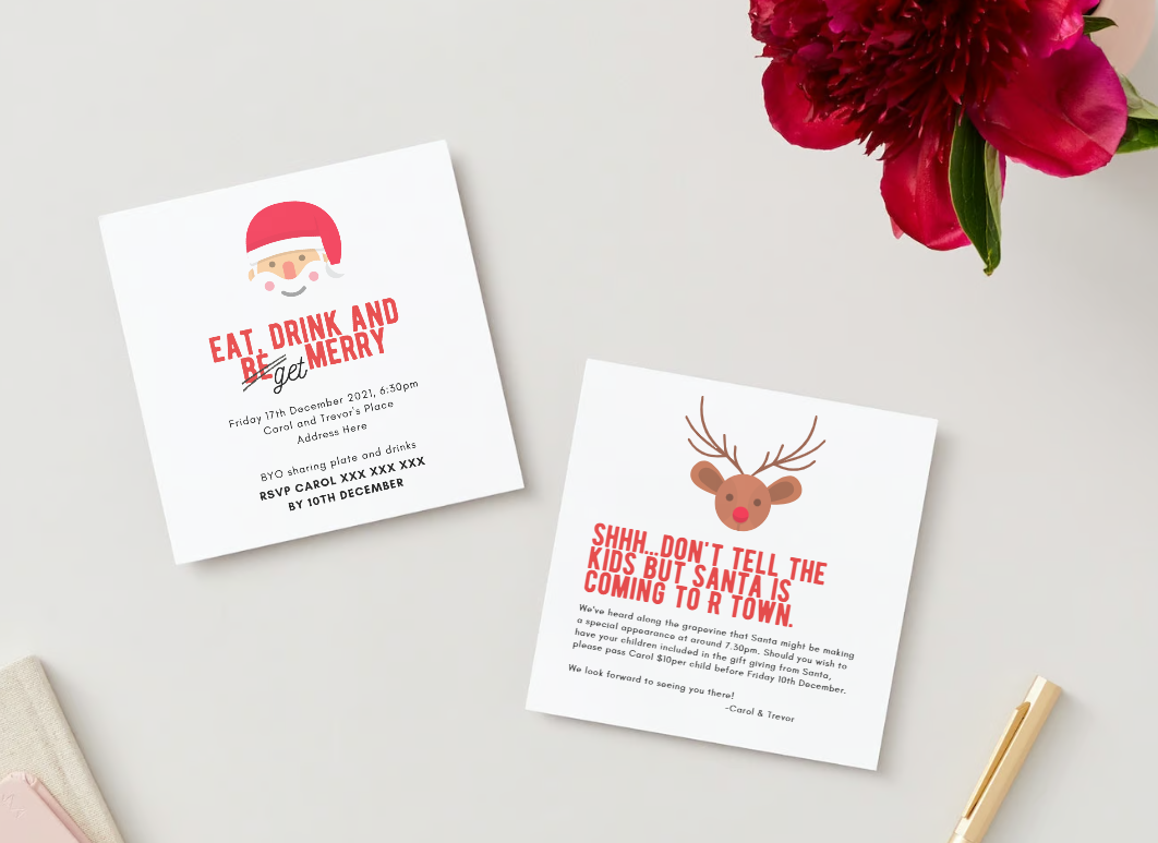Two Christmas party invitations on a desk, one with a Santa face and the other with a reindeer head. A pink flower in the top right corner and a pen in the bottom right corner.