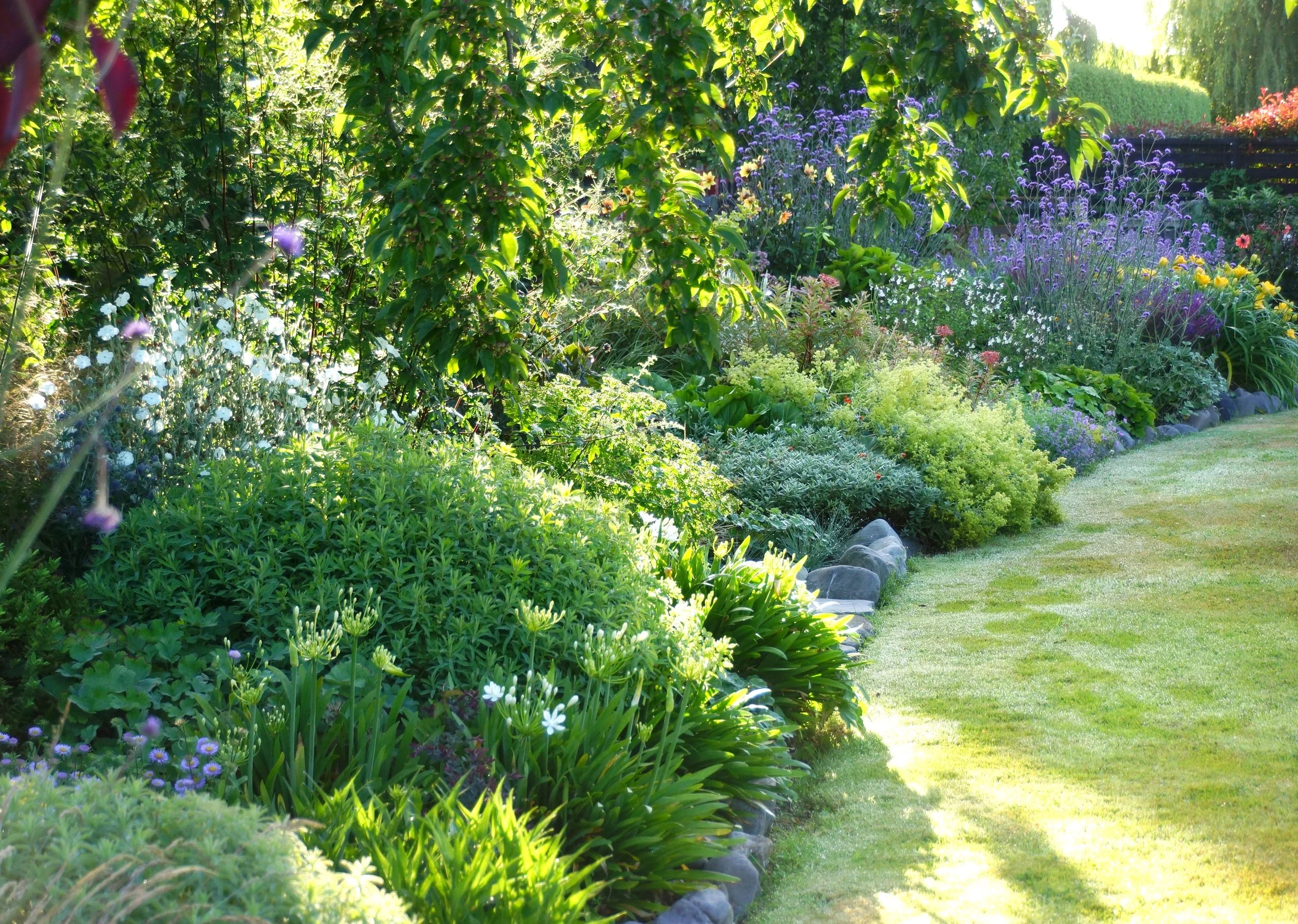 The outer edge of the shady gardens.