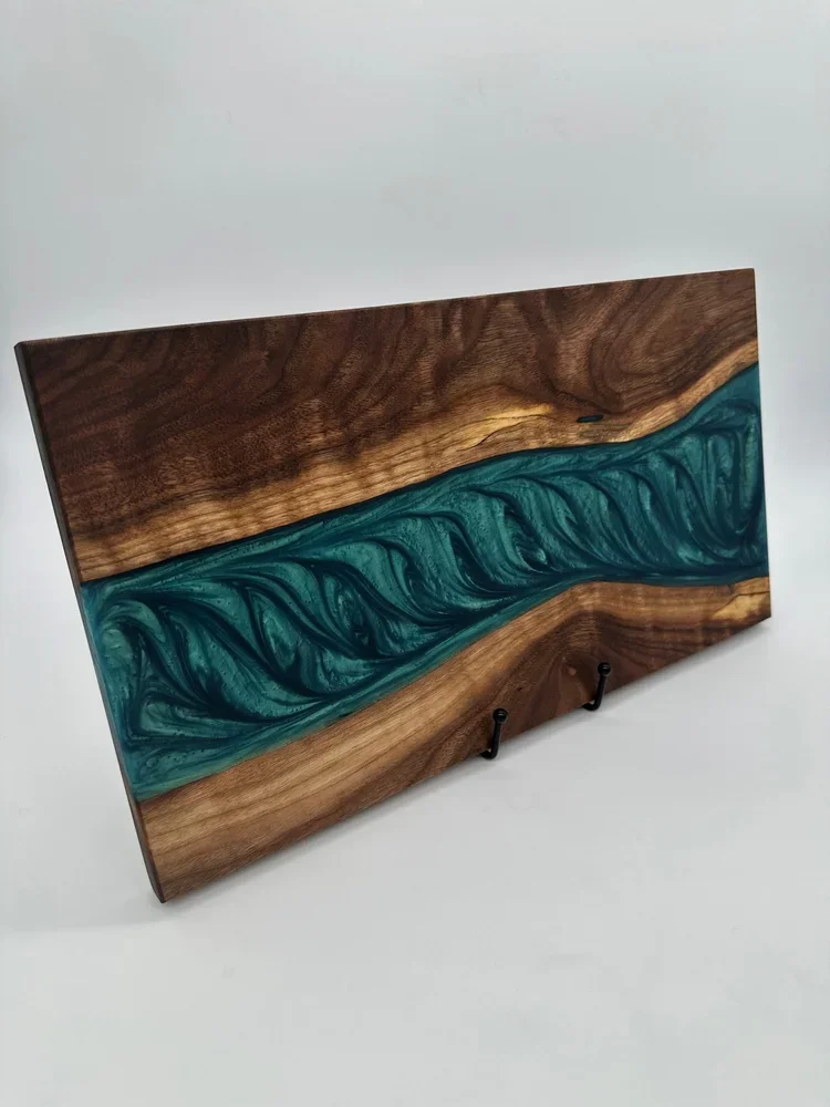 Serving / charcuterie board made with Walnut & Mermaid Dust epoxy