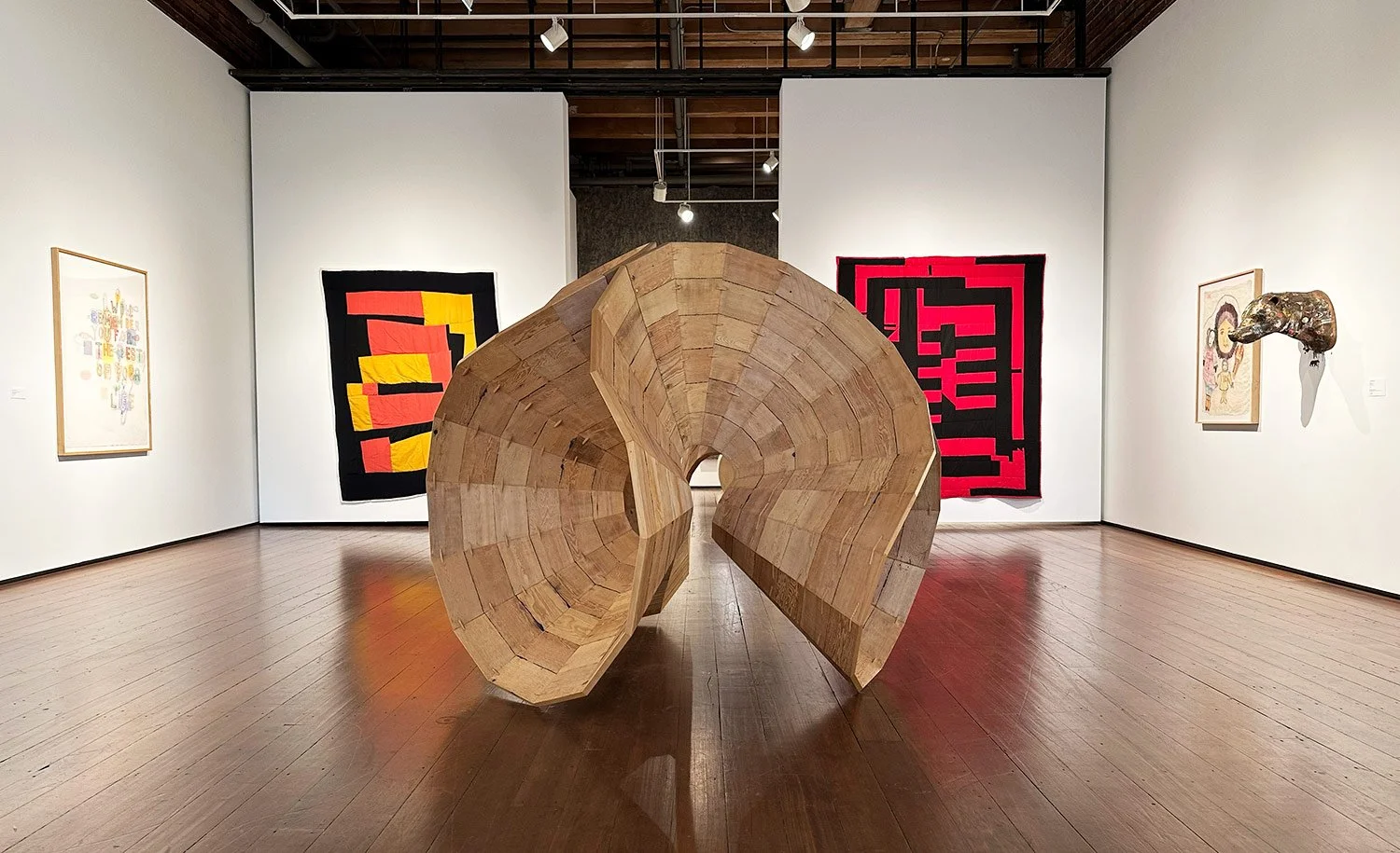 install image includingwork on paper by Graham Gillmore, 2 quilts by Loretta Pettway Bennett, Sculpture by Cris Bruch, and 2 works by Sherry Markovitz