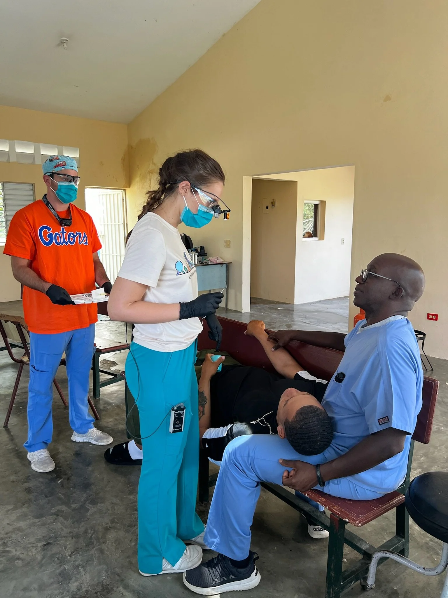 photo_3_dr_roger_assist_dental_students.jpeg