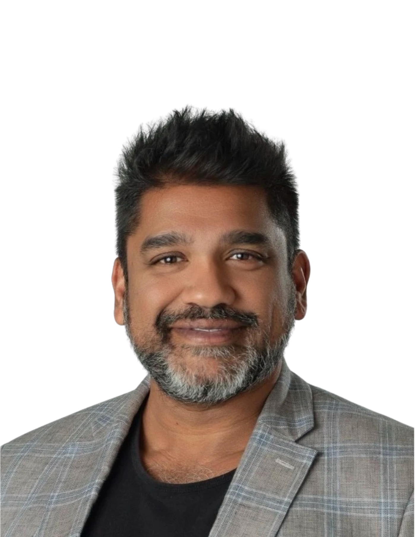 Headshot of a man with short black hair, a beard with gray, wearing a gray checkered blazer over a black shirt, smiling against a plain white background.