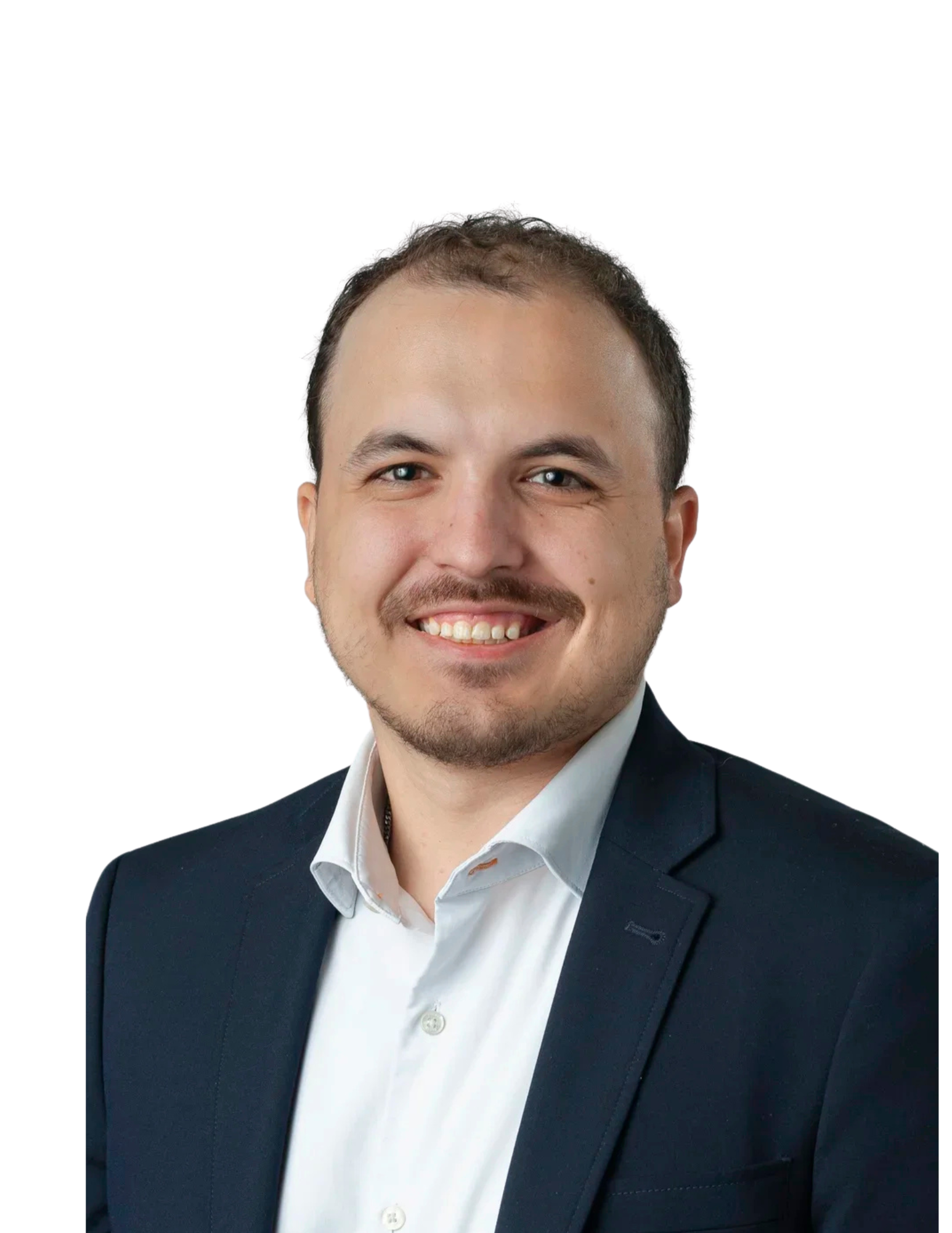 Headshot of a smiling man wearing a dark blazer and white shirt against a white background.