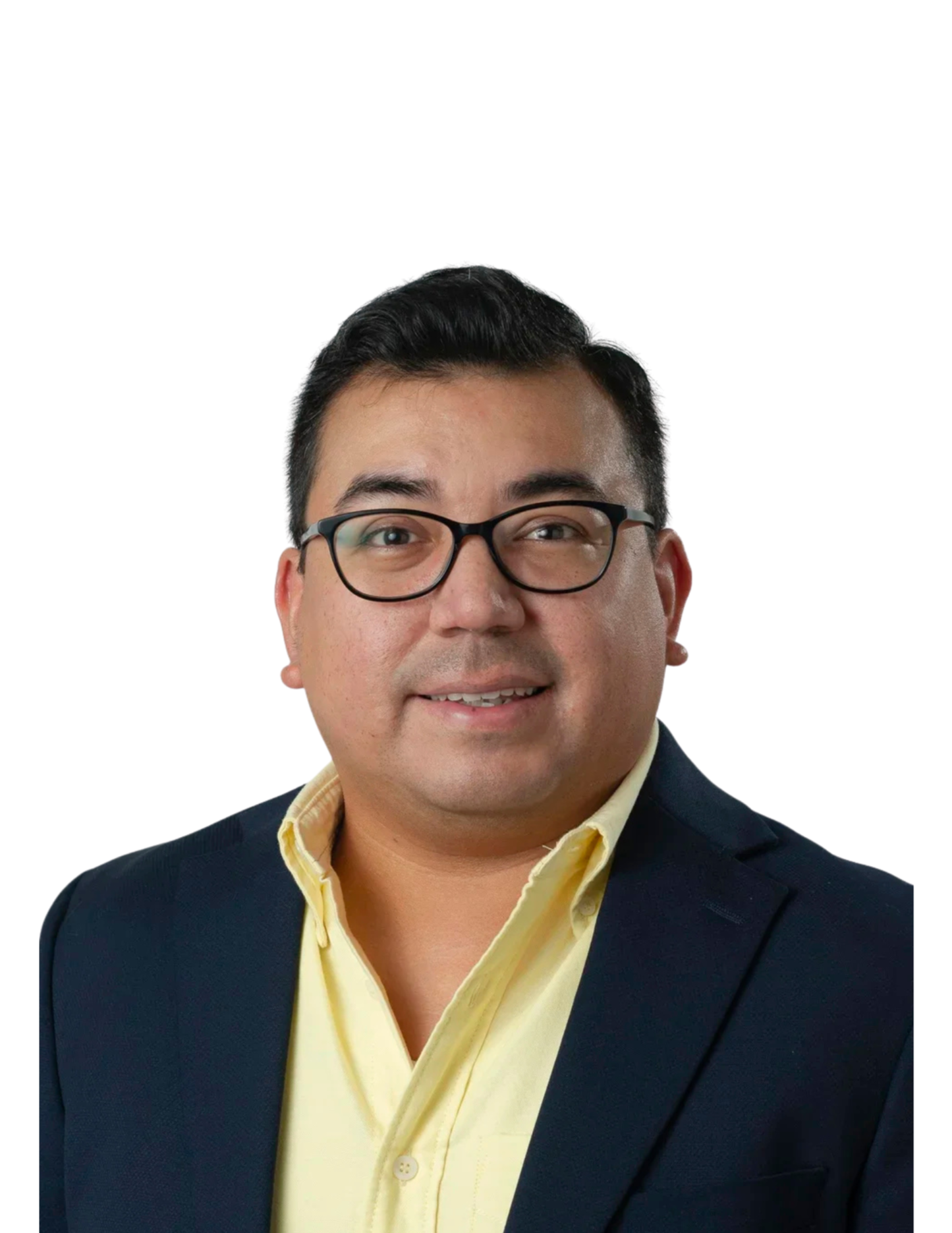 Portrait of a man with short black hair, wearing glasses, a yellow collared shirt, and a dark blazer, smiling against a white background.