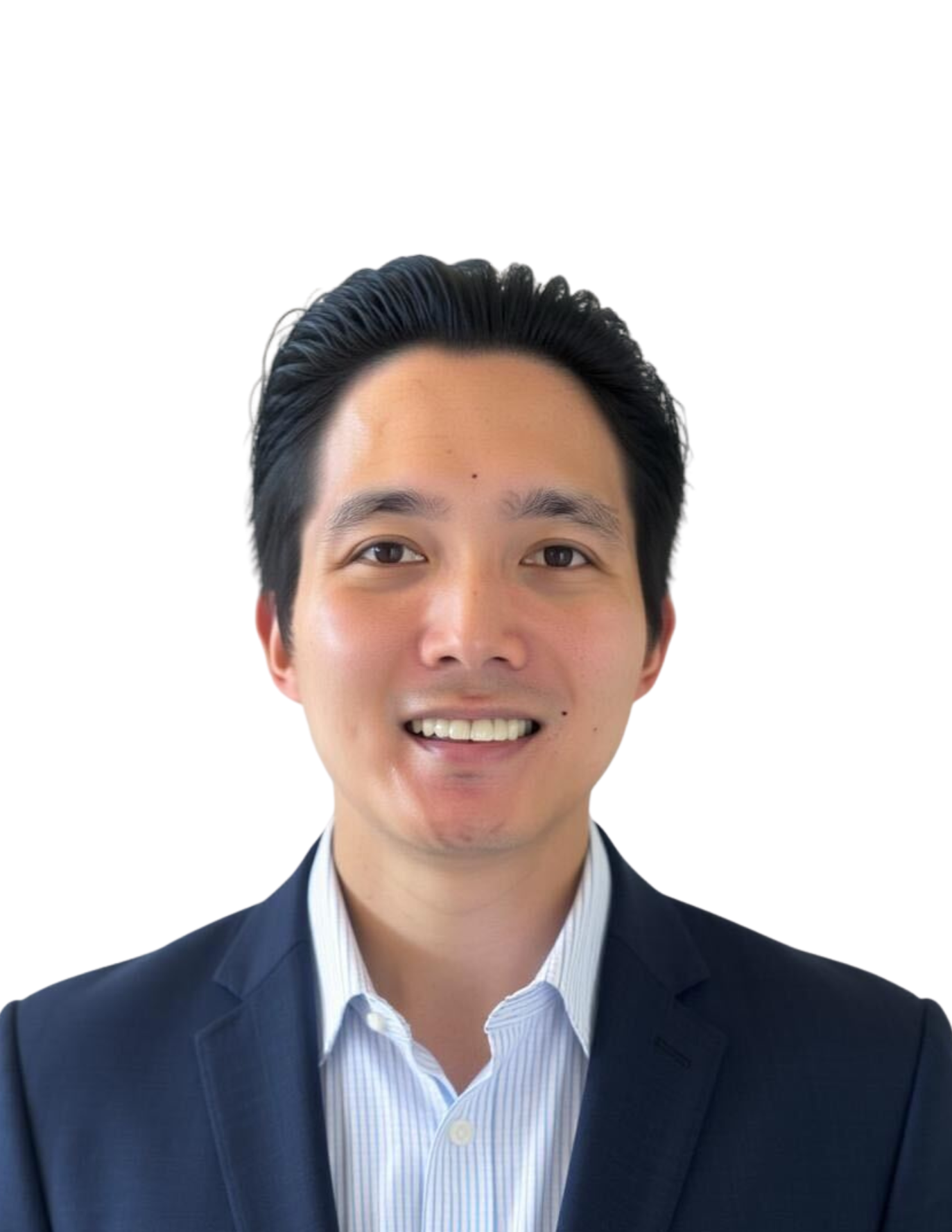A young man with black hair, wearing a dark suit and a light blue collared shirt, smiling against a white background.