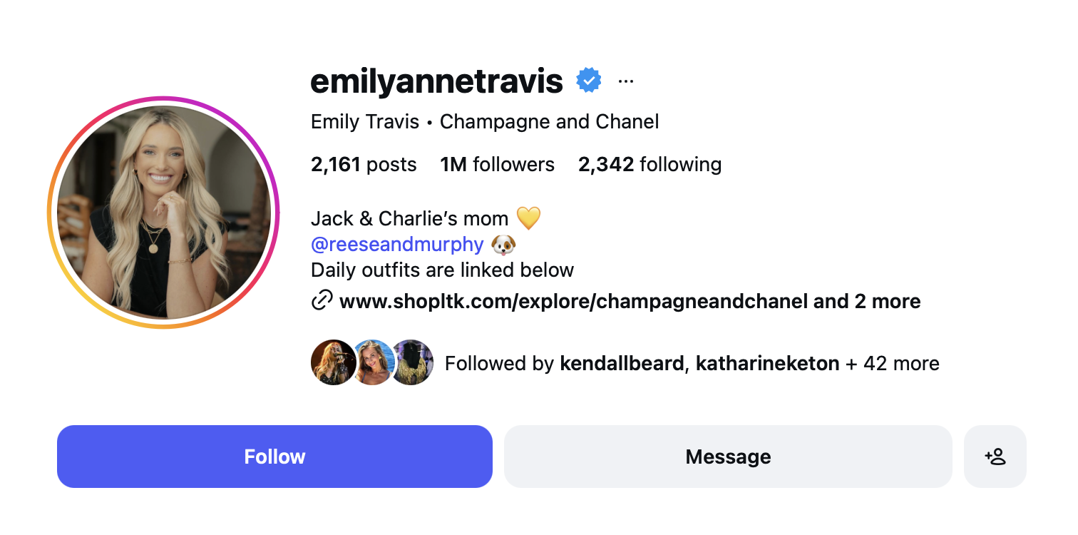 Instagram profile of Emily Travis, featuring a profile photo of a smiling blonde woman with light makeup, wearing a black top, looking at the camera, with a blurred indoor background.