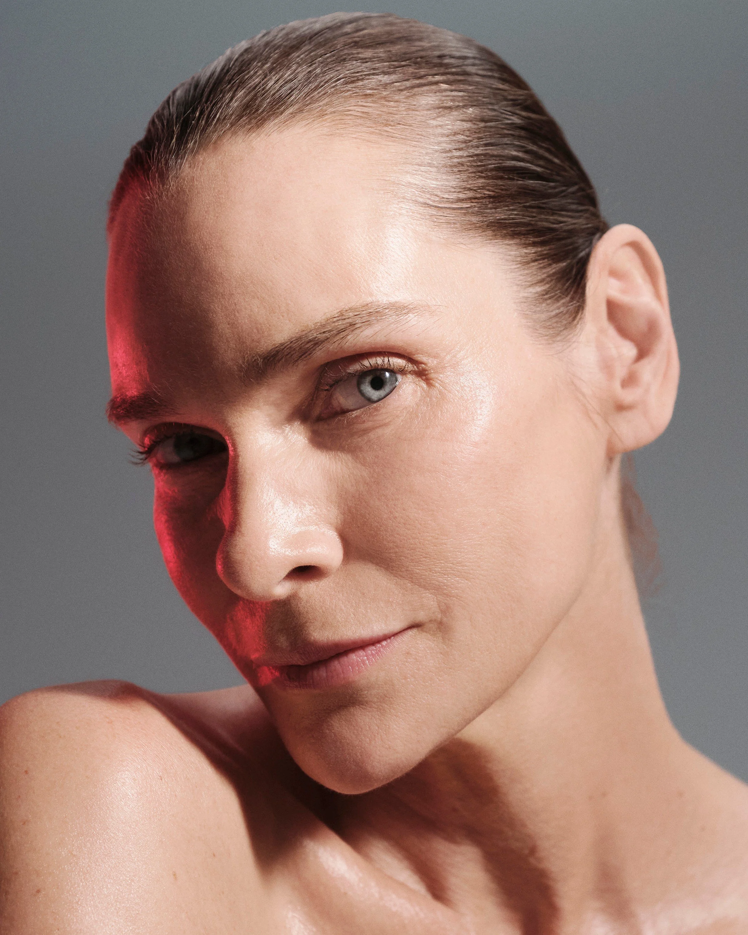 Close-up of luminous skin and sleek hair in warm light for ZO Skin Health. Hair and makeup by Amber Rose.