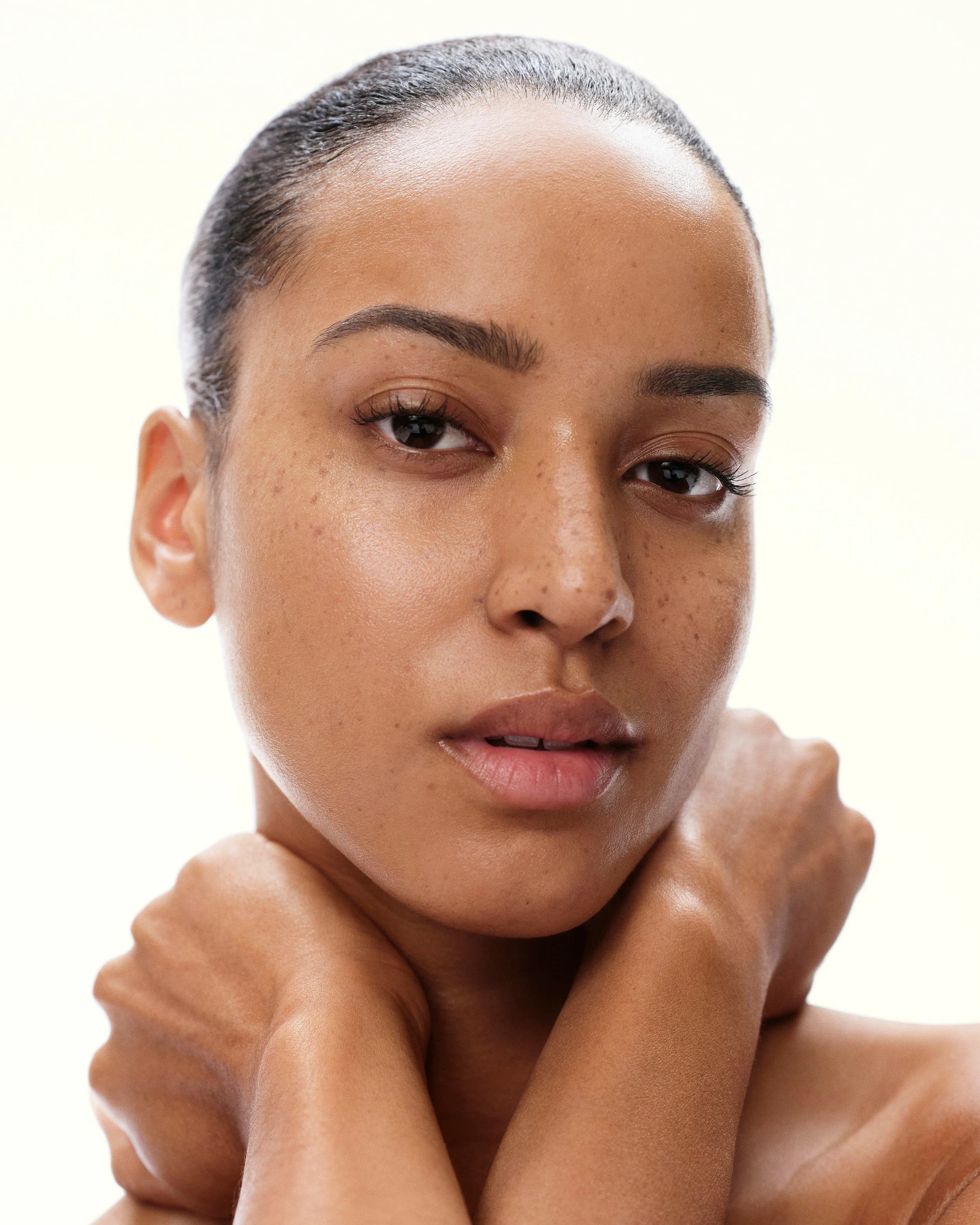 Model with sleek hair and healthy, radiant skin for the ZO Skin Health Sunshade campaign. Hair and makeup by Amber Rose.