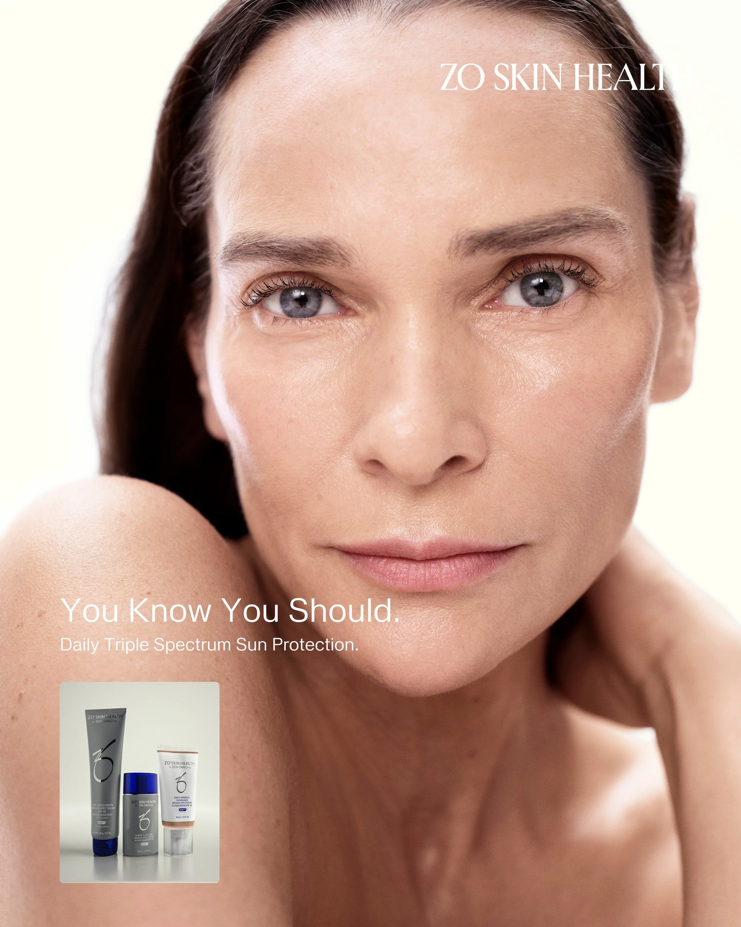 Model with glowing skin alongside ZO Skin Health Sunshade products. Hair and makeup by Amber Rose.