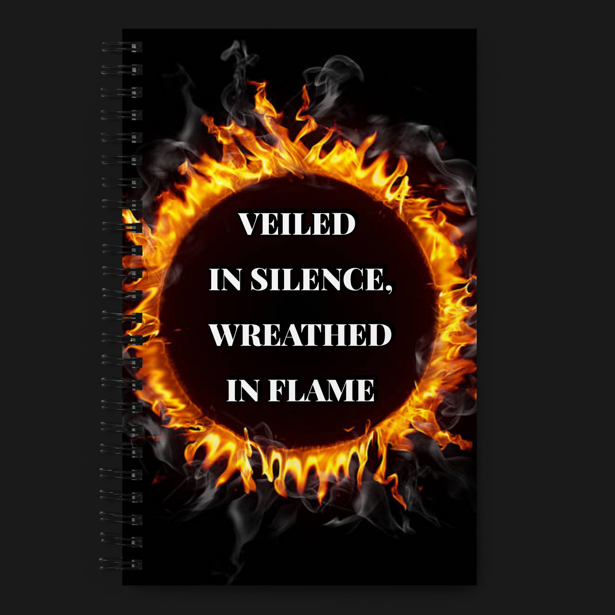 Spiral notebook from the WPB Emporium Onyx Collection featuring a black cover with a fiery circular design and the phrase “Veiled in Silence, Wreathed in Flame.”