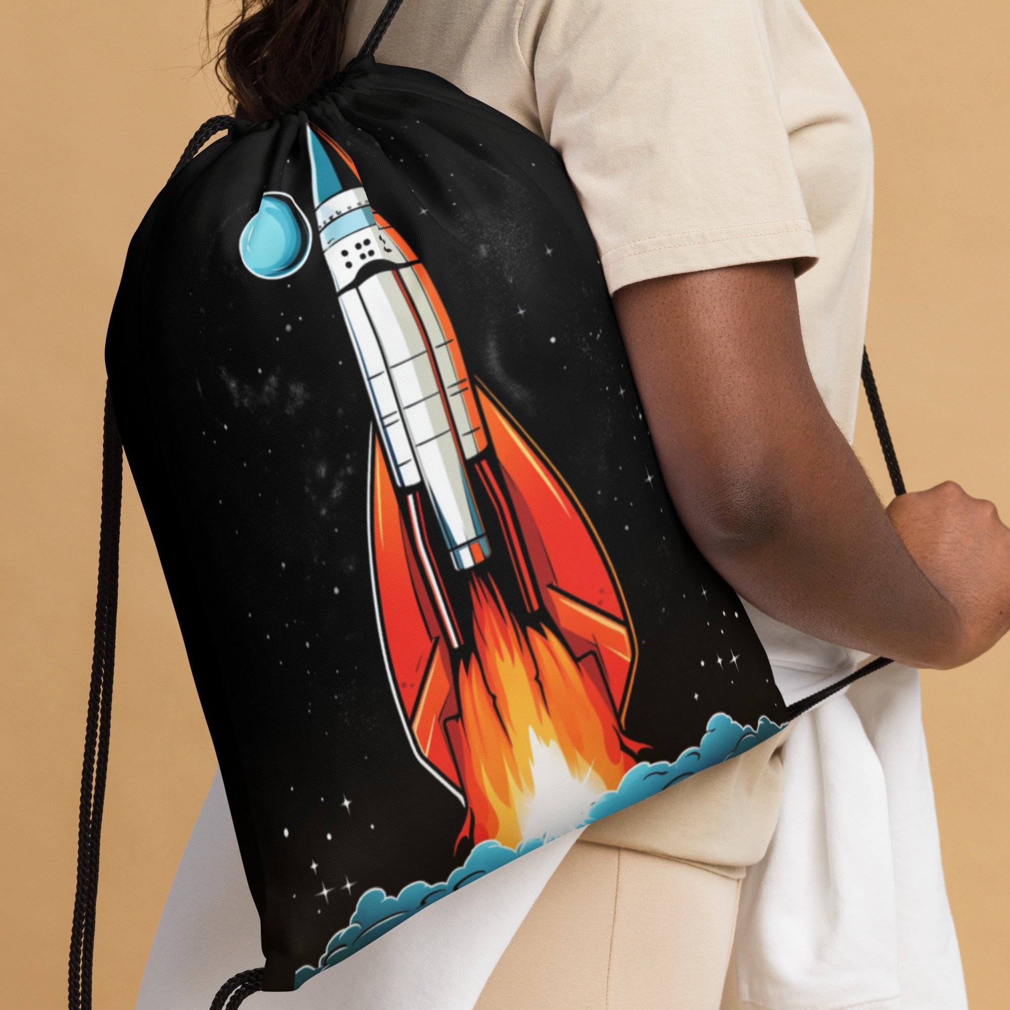 Close Up Someone wearing Lightweight Drawstring Backpack With Retro Rocket Graphic on Black Background Design for Hiking and Outdoor Activities