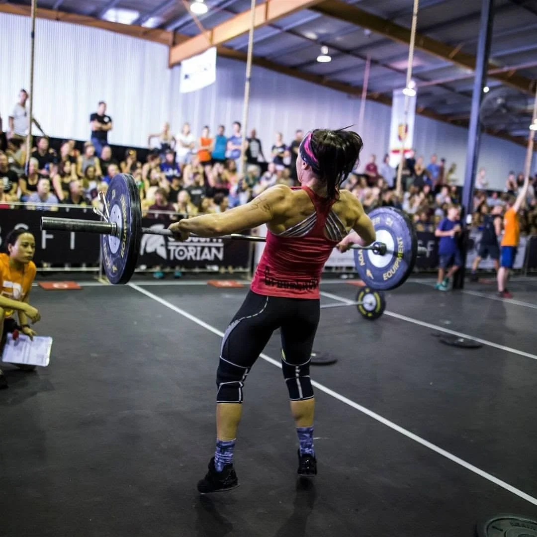 Affiliate owner Lisa Lake competing at the Torian Pro, mid-rep of a barbell snatch.