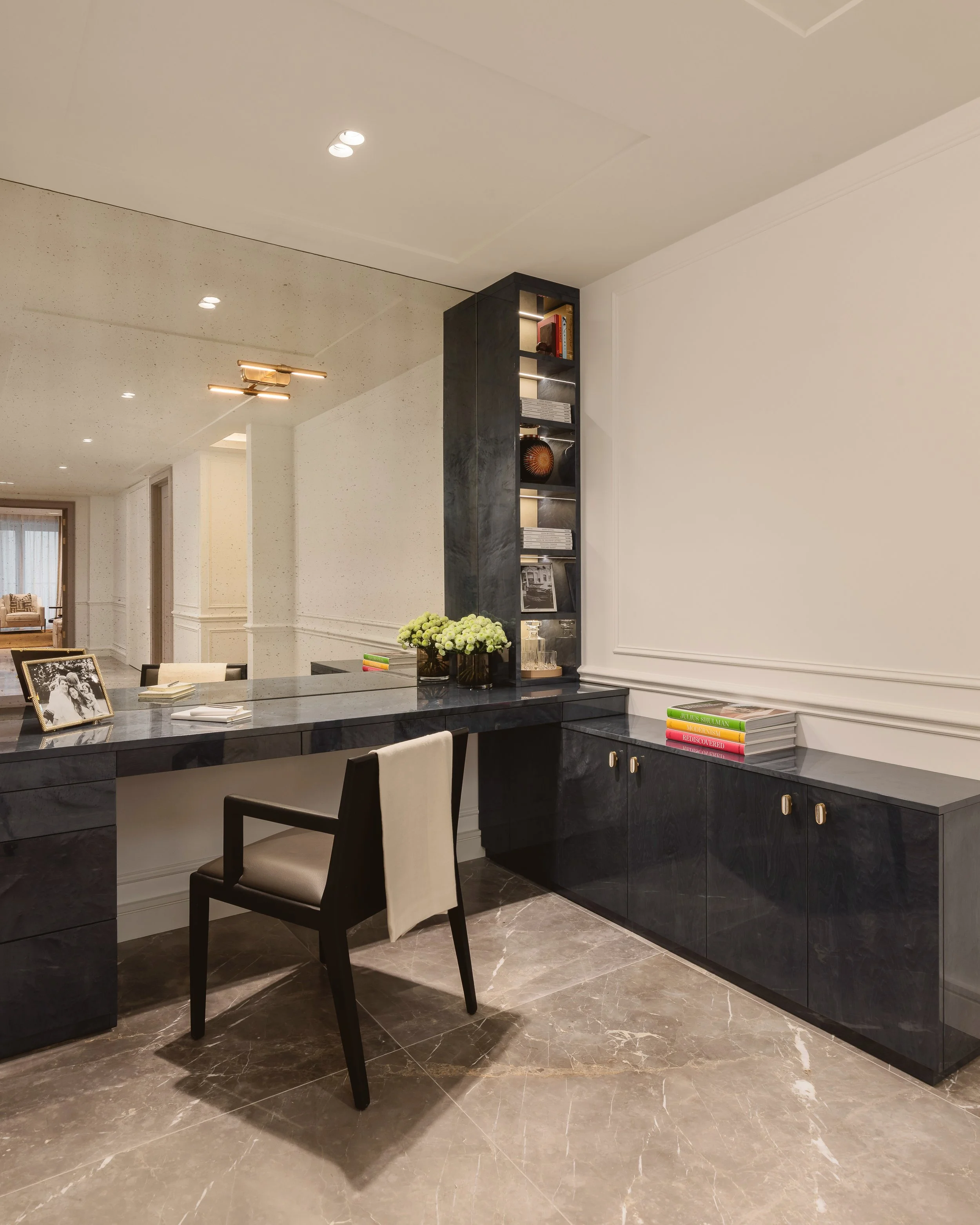 Study with desk and built-in shelving in a two-bedroom apartment at Holland Park Gate, Kensington, London