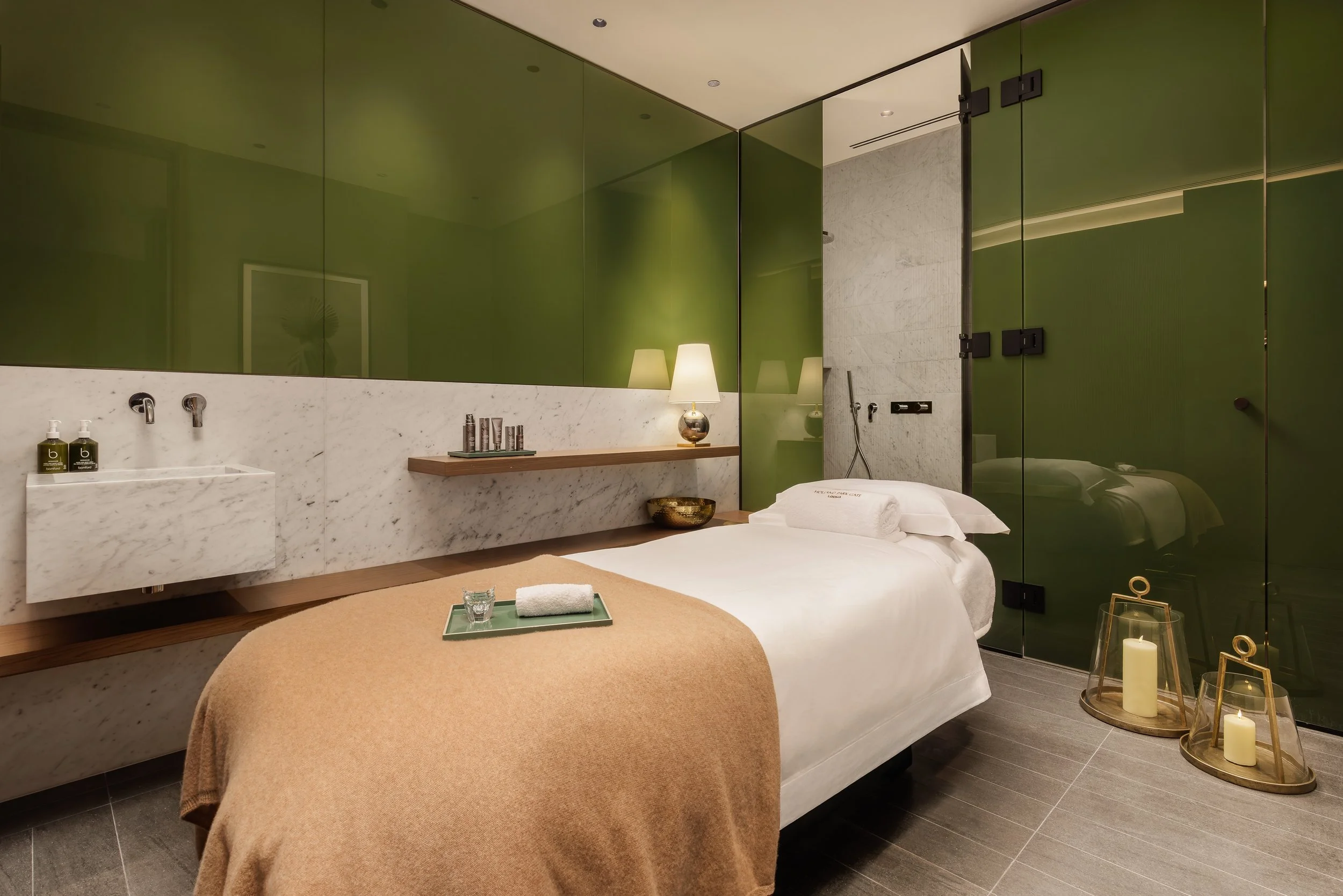 Private spa treatment room with massage bed and marble basin at Holland Park Gate health club, Kensington, London