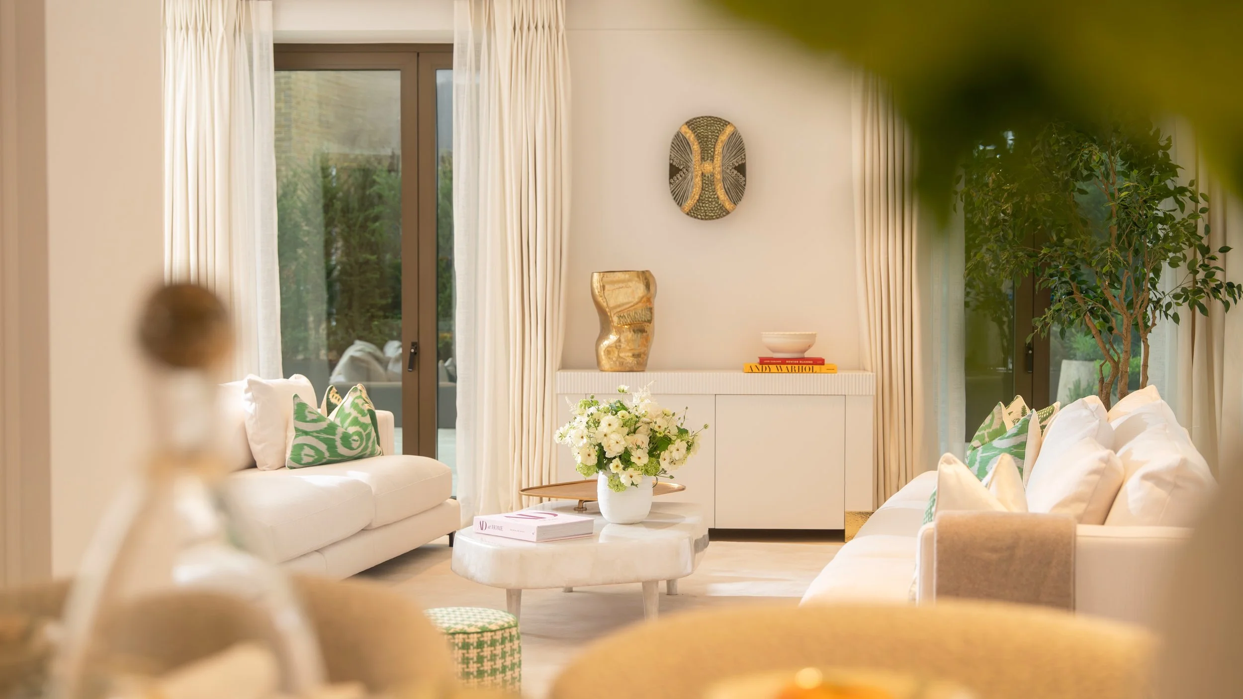 Light-filled living room with garden terrace doors in a luxury apartment for sale at Holland Park Gate, Kensington, London
