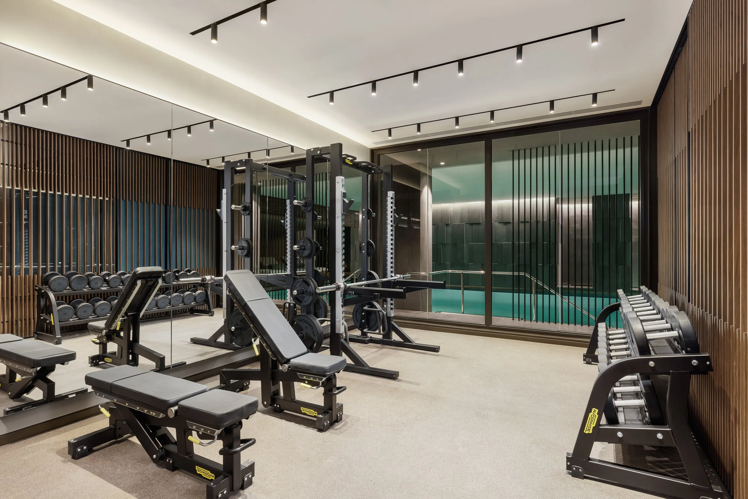 Fully equipped residents' gym with weights and cardio machines at Holland Park Gate, Kensington, London