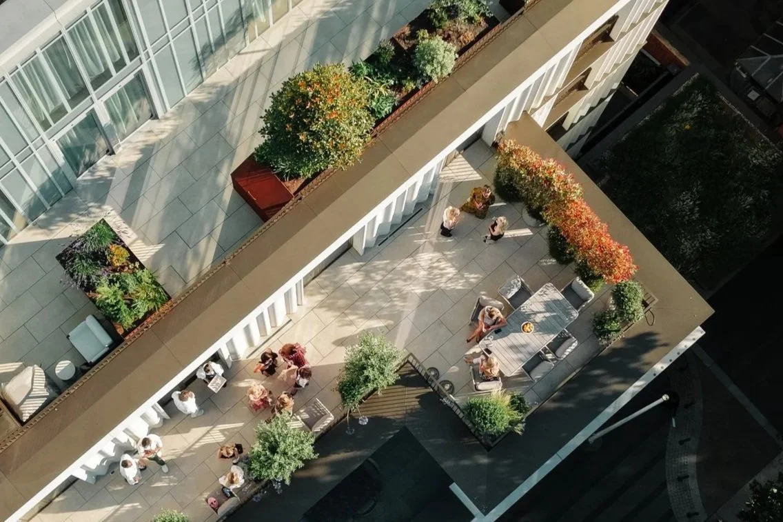 Aerial view of a landscaped private terrace with outdoor dining at Holland Park Gate, Kensington High Street, London