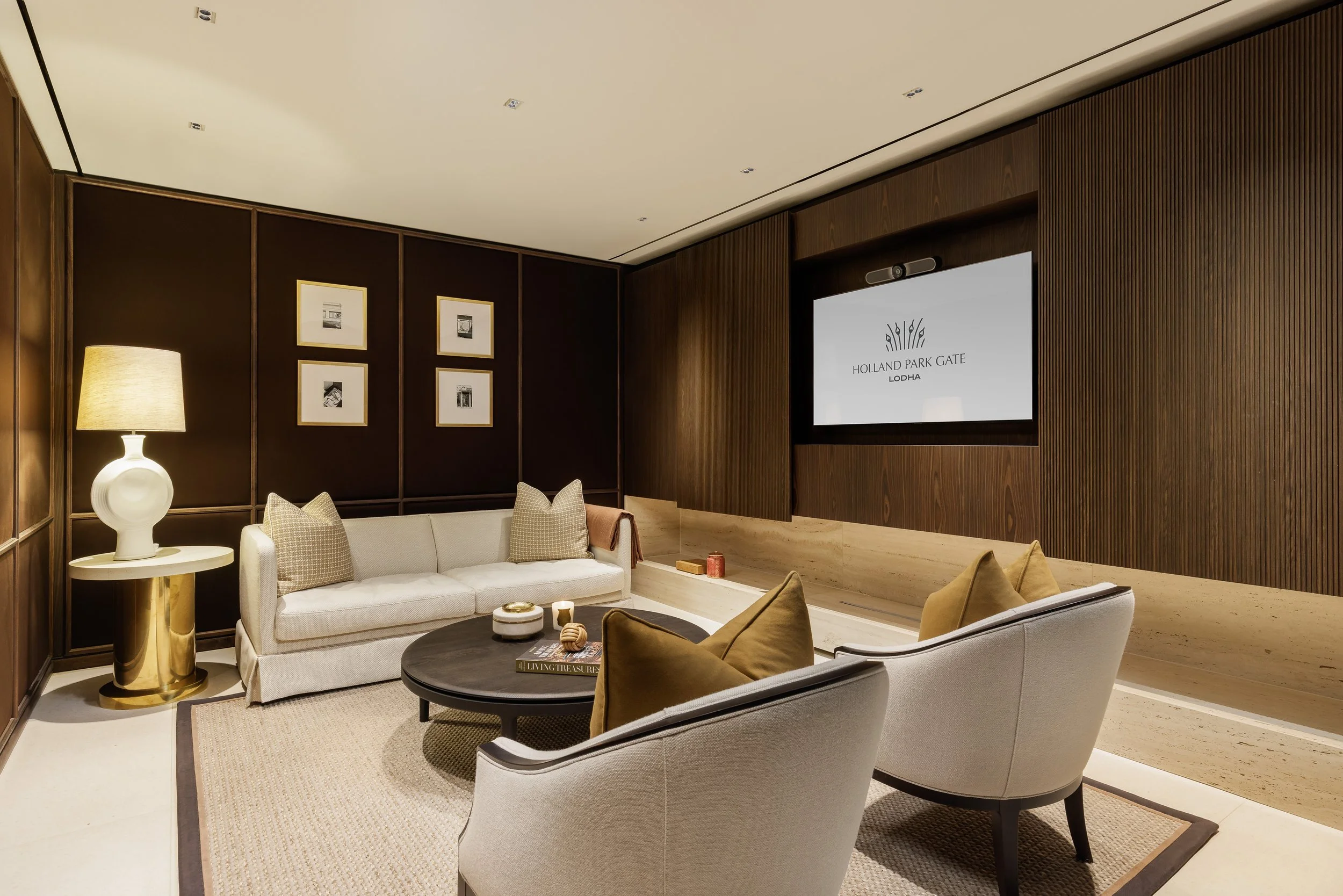 Residents' meeting room with lounge seating and presentation screen at Holland Park Gate, Kensington, London