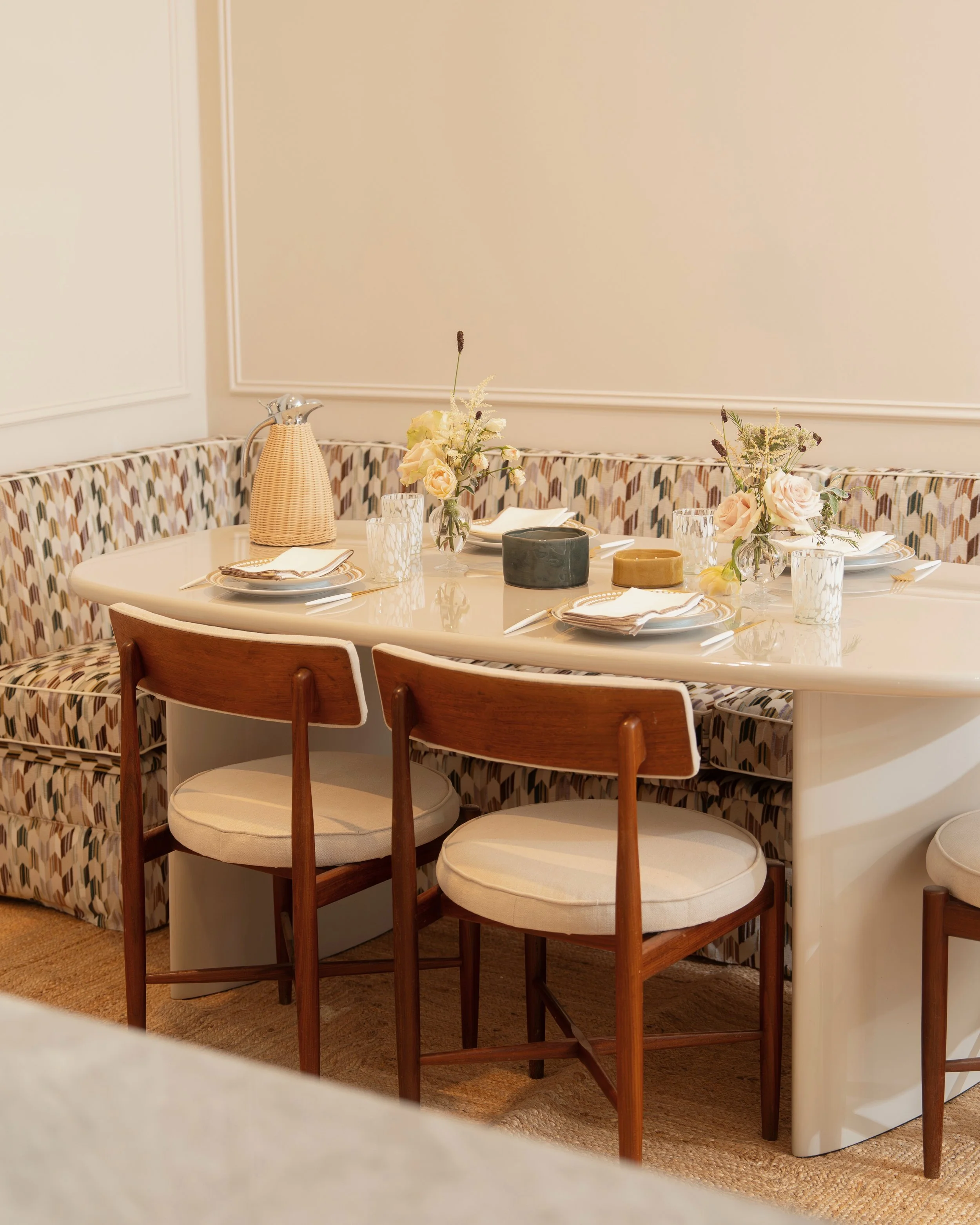 Dining nook with banquette seating in a one-bedroom apartment at Holland Park Gate, Kensington, London