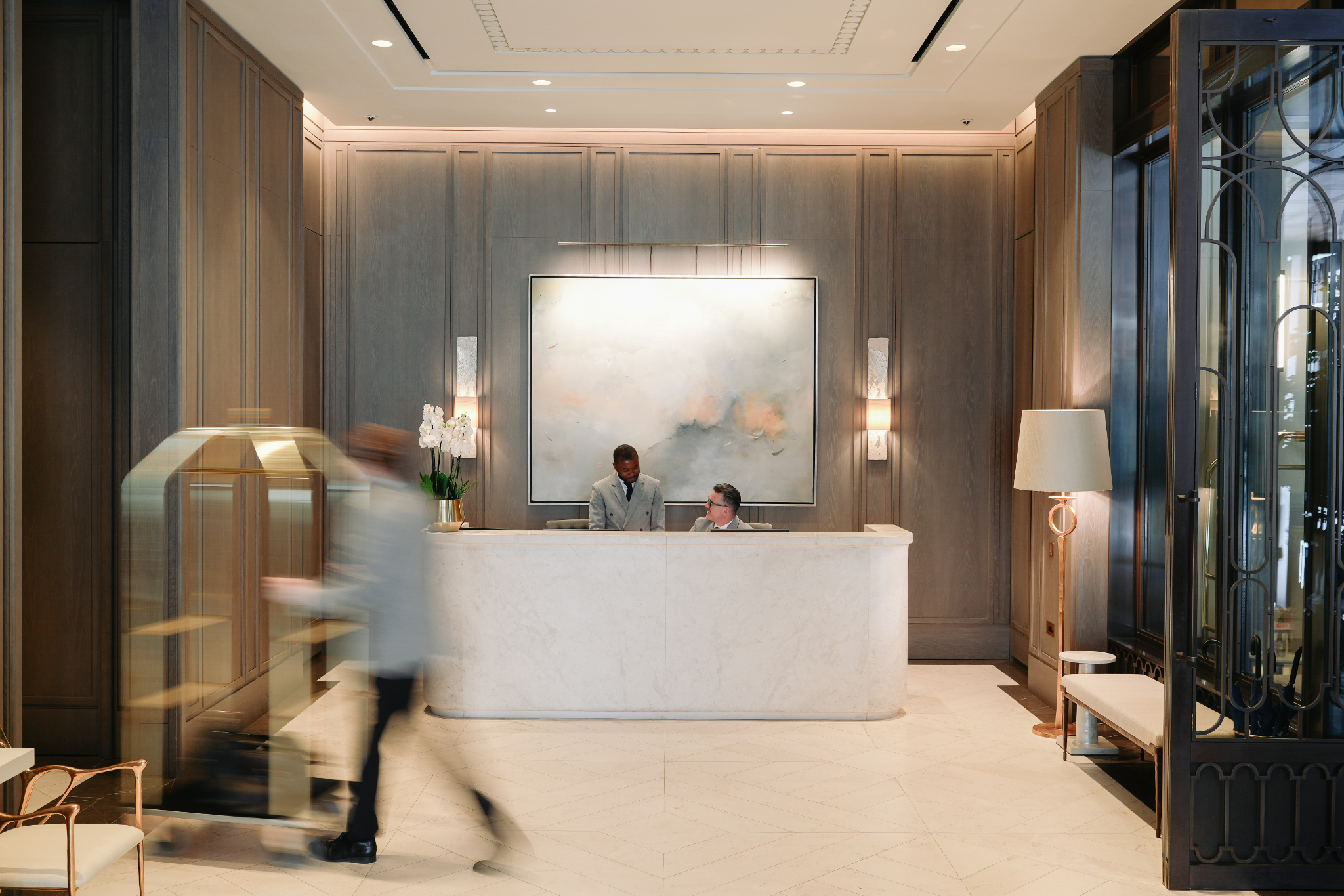 Marble concierge desk in the oak-panelled lobby at No.1 Grosvenor Square, Lodha, Mayfair, London