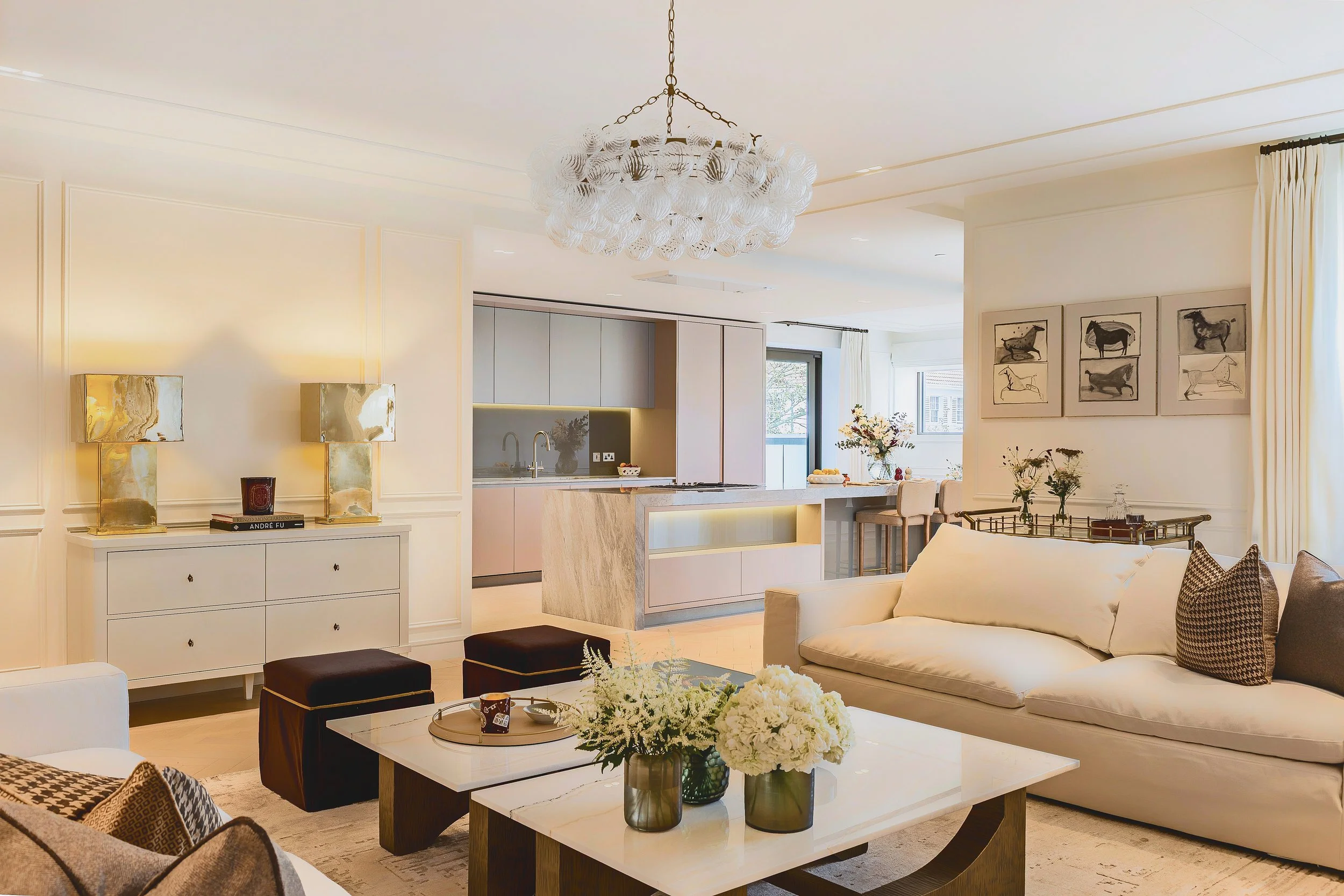 Open-plan living room and marble island kitchen in Residence 82 at Holland Park Gate, Kensington, London