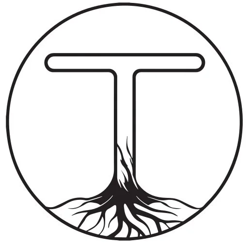 A black and white circular logo featuring a letter T with roots beneath it, symbolizing growth or foundation.