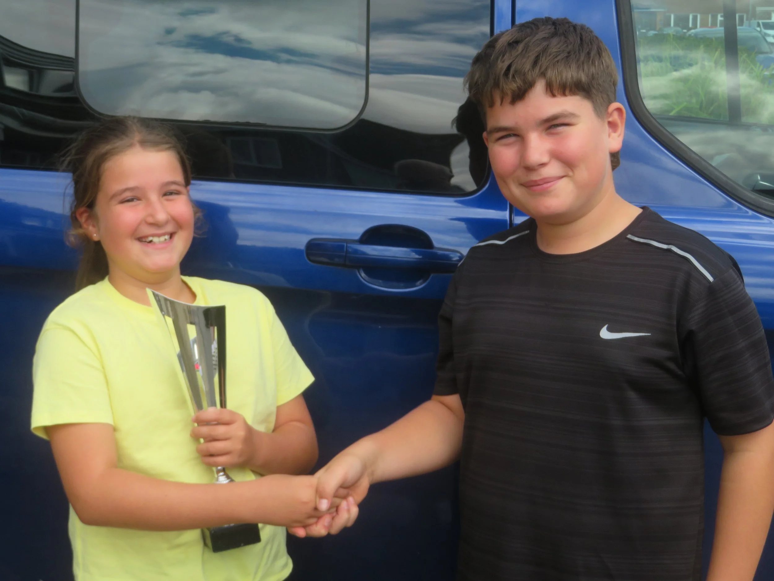 Ivy Reeves congratulated by brother Dexter.JPG