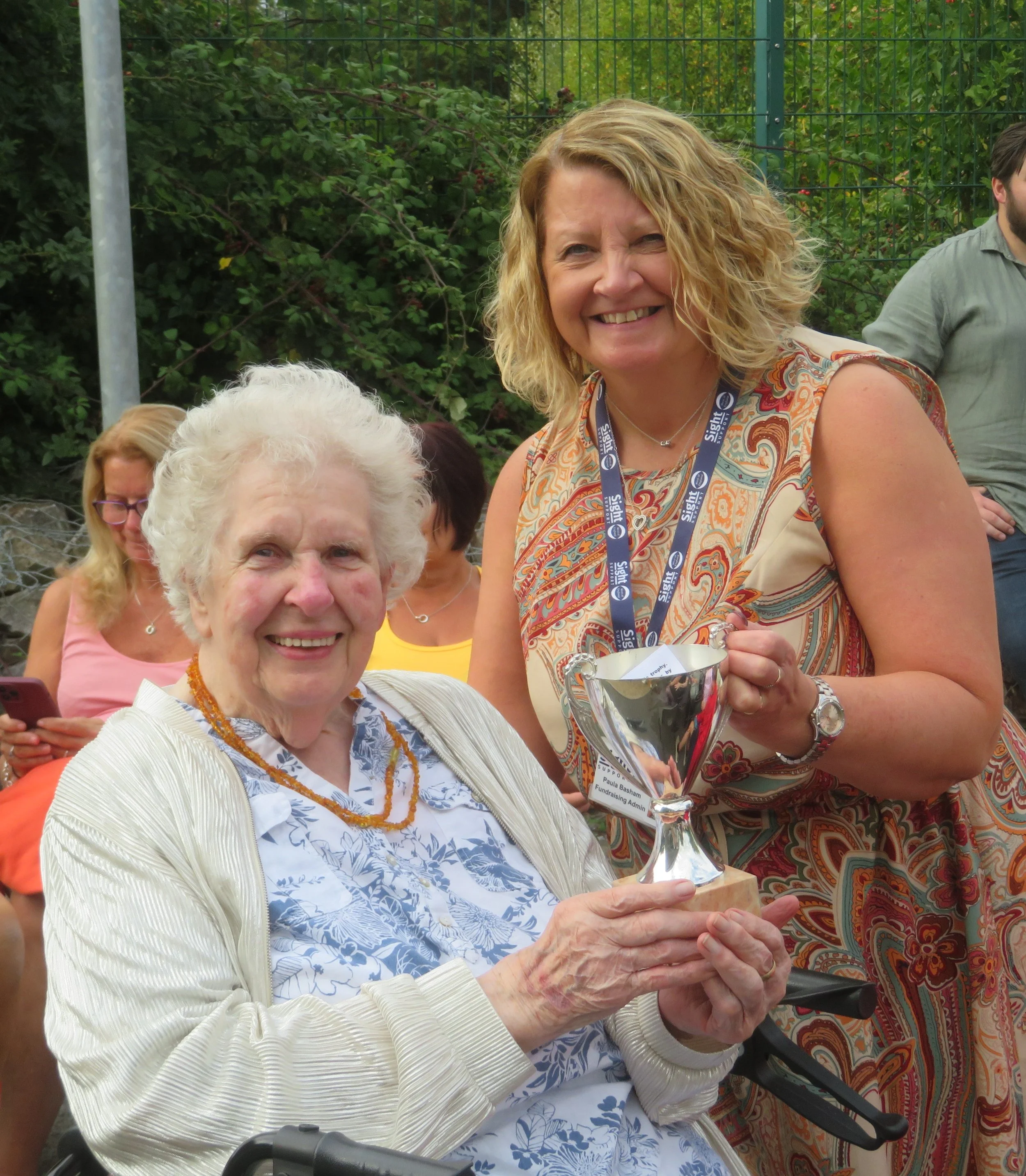 Paul from Sight Support presented Pat with her trophy during the 2025 Flower Show award ceremony