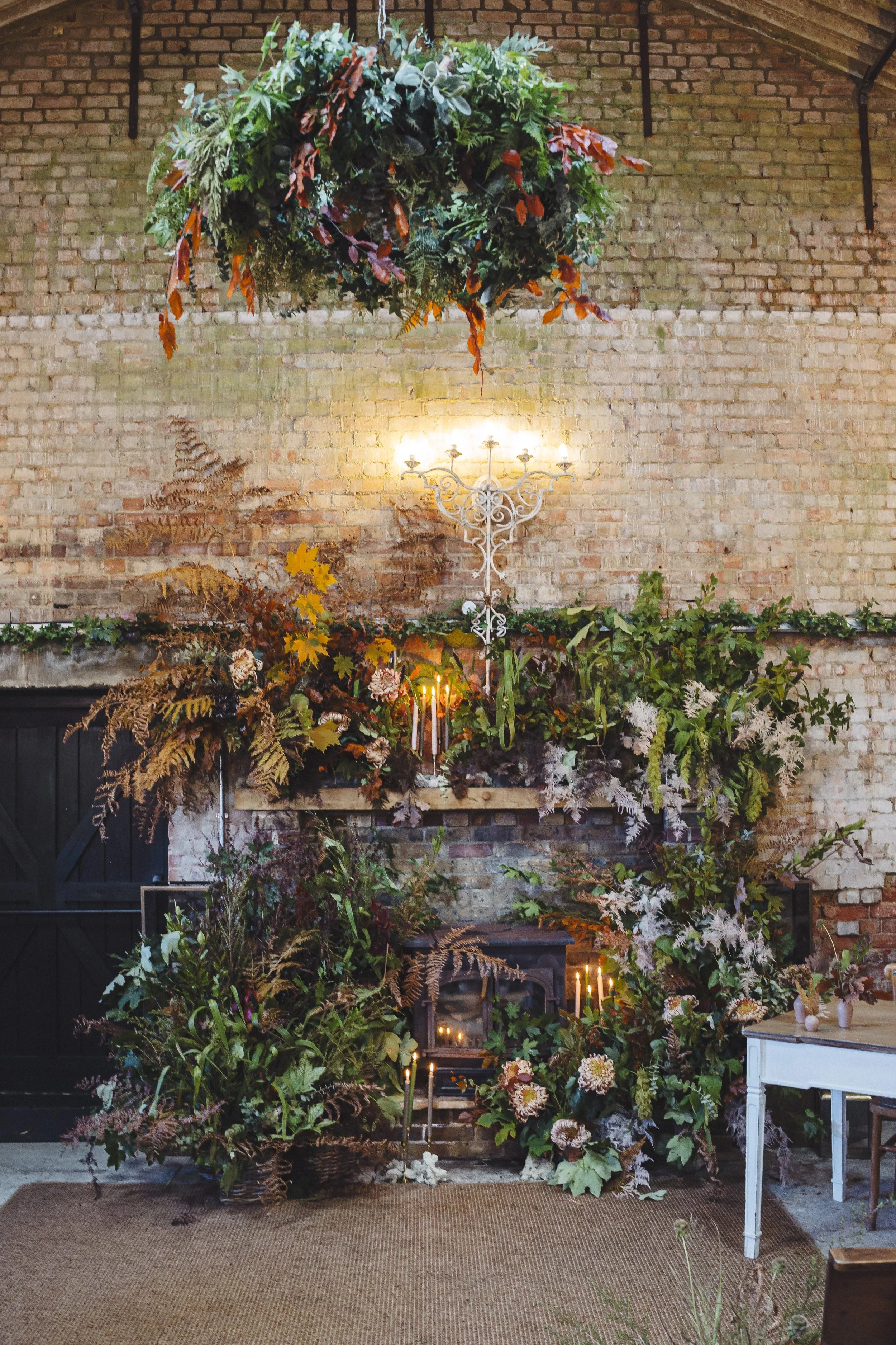Autumnal foliage fireplace at Botley Hill Barn for wedding ceremony