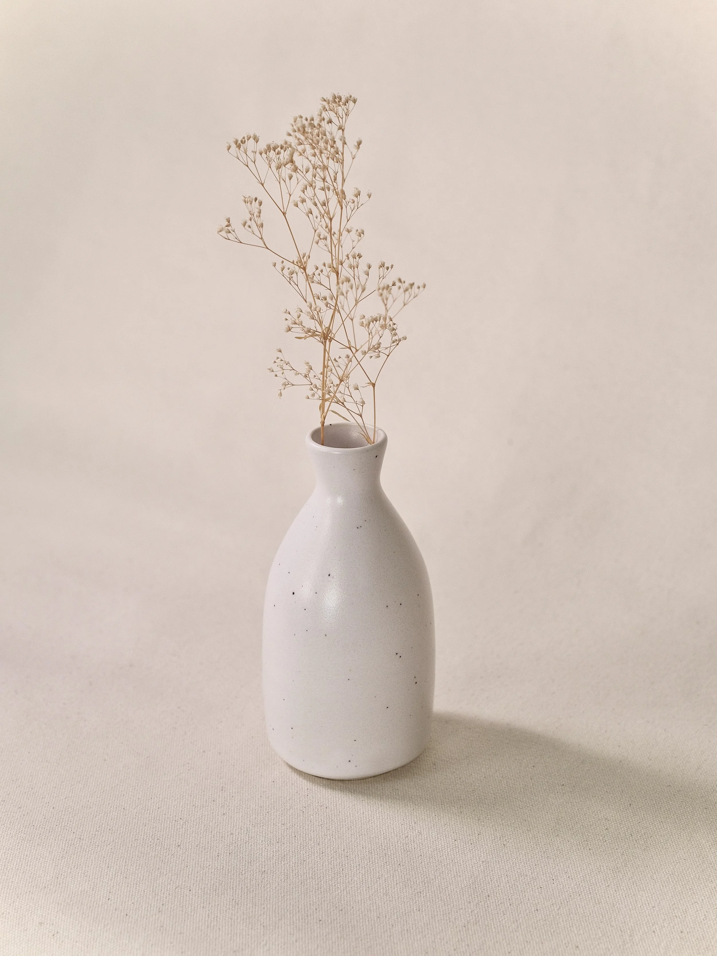 Little Fire Ceramics_six inch bud vase_dalmatian_with flower.jpeg