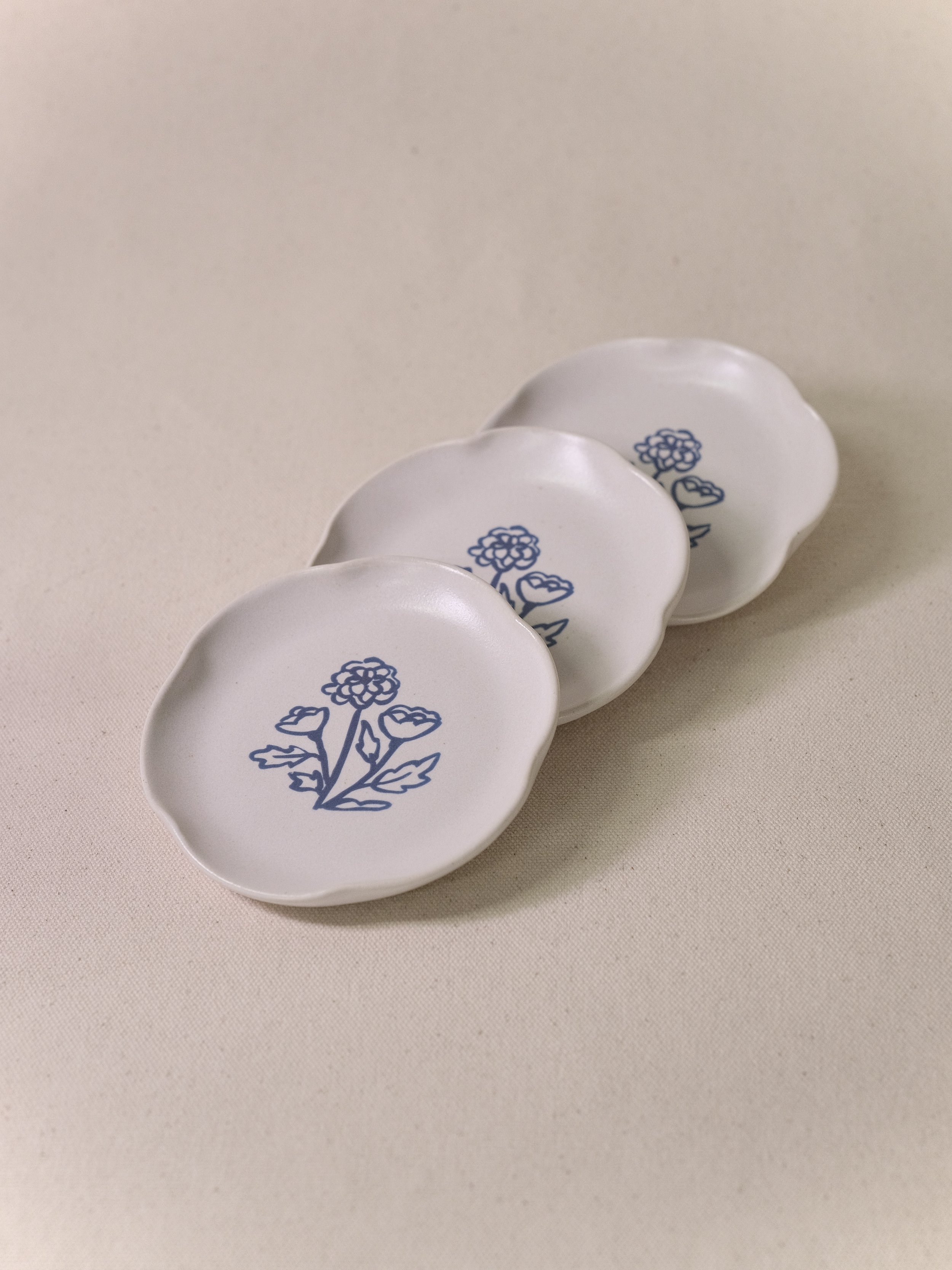 Little Fire Ceramics_Aly Miller_Illustrated Marigold Plate_Trio.jpeg